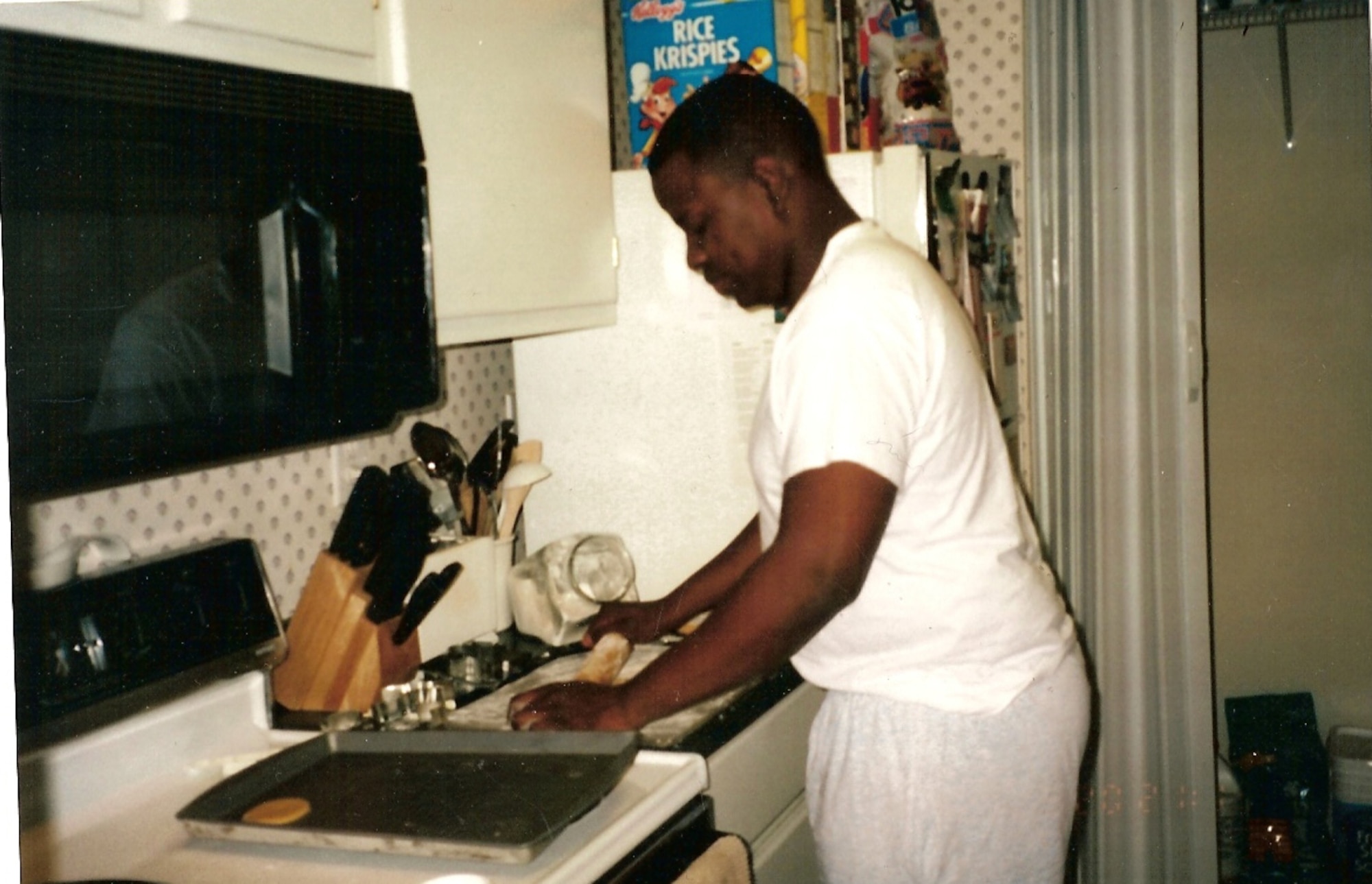 WHITEMAN AIR FORCE BASE, Mo. – Micheal Boswell makes cookies more than two years prior to the 2008 Natural Southern States Classic body building competition at Liberty, Mo. Captain Boswell, 509th Logistics Readiness Squadron, lost 50 pounds since this picture was taken and came in 4th place in his division at the 2008 Natural Southern States Classic. (Photo printed with permission of Captain Boswell)