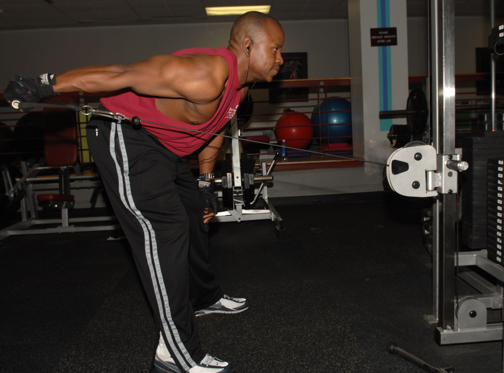 WHITEMAN AIR FORCE BASE, Mo. - Capt. Michael Boswell, 509th Logistics Readiness Squadron, works on his triceps by performing a kickback at the fitness center May 7. Captain Boswell recently came in 4th place in his division at the 2008 Natural Southern States Classic in Liberty, Mo. (U.S. Air Force photo/Airman 1st Class Stephen Linch)