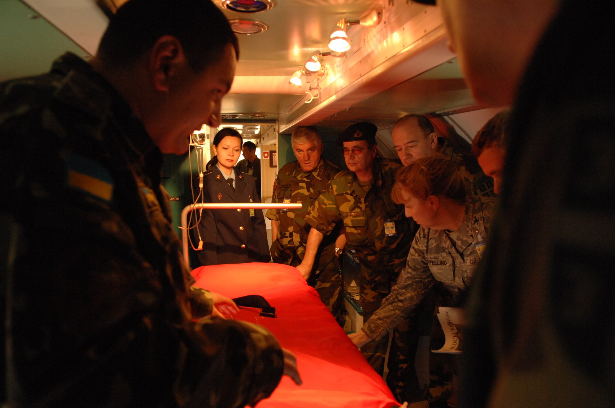 DIVULJE TRAINING BASE, Croatia – Ukranian Army Capt. Vyacheslav Kondratyuk highlights the operating room in the Ukranian Vitae aircraft May 12 during the 2008 Medical Training Exercise in Central and Eastern Europe (MEDCEUR).  Sixty visitors toured the flying hospital during the MEDCEUR Distinguished Visitors Day.  Fifteen nations are participating in the exercise from May 2 through 14. The exercise focuses on mass-casualty training scenarios and humanitarian aid in response to crises situations. MEDCEUR is a Joint Chiefs of Staff regional/multilateral exercise sponsored by U.S. European Command. Croatia is hosting the 2008 exercise which has drawn about 400 multi-nationals in support of the Partnership for Peace initiative. (U.S. Air Force photo/Staff Sgt. Kristin Ruleau) 
