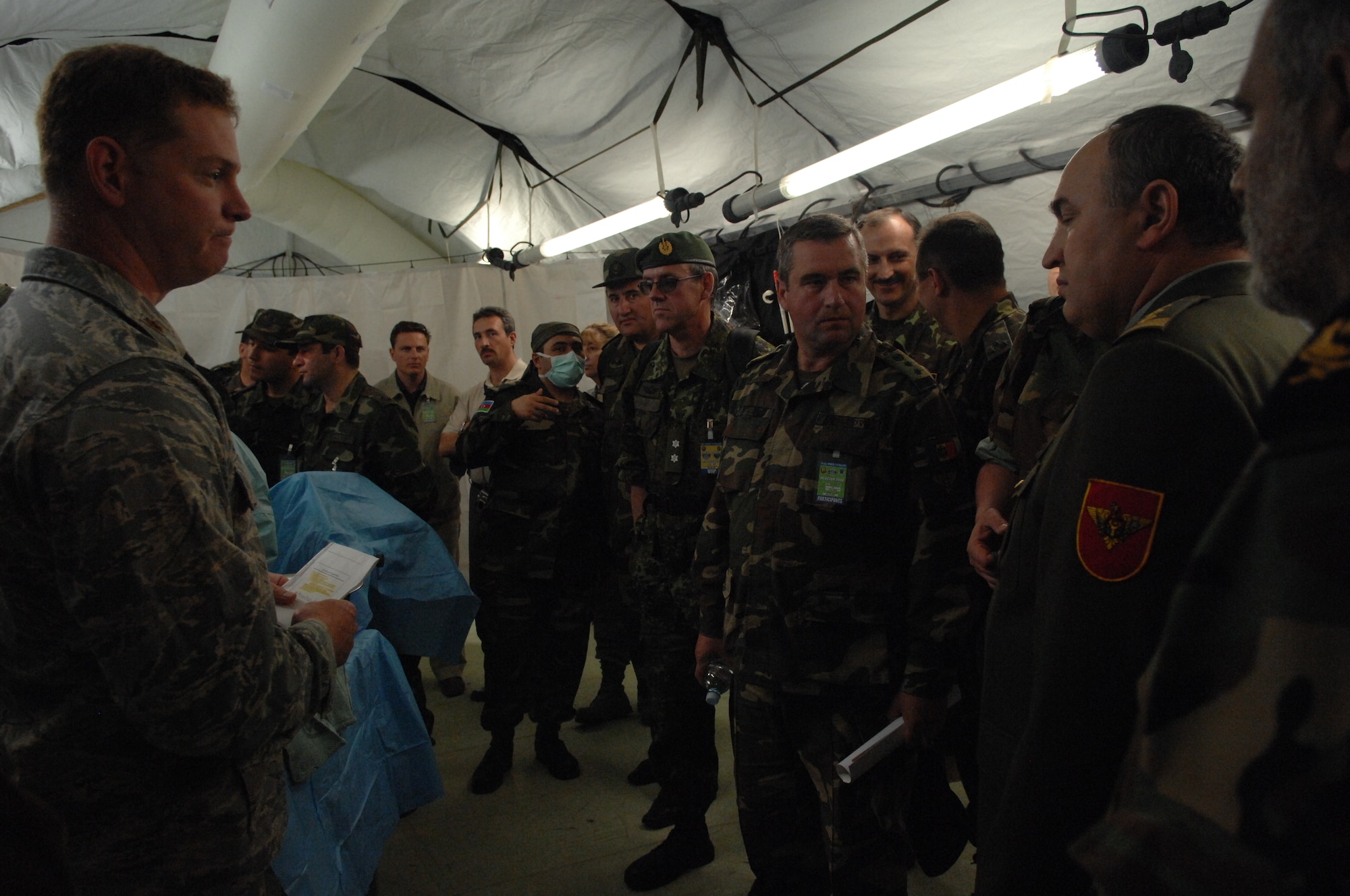DIVULJE TRAINING BASE, Croatia – U.S. Air Force Lt. Col. Sean Giery, a clinical nurse with the 458th Expeditionary Medical Squadron, addresses visitors of foreign delegations during the 2008 Medical Training Exercise in Central and Eastern Europe (MEDCEUR) Distinguished Visitors Day May 12.  The mass-casualty exercise applies the knowledge troops gained the week prior during MEDCEUR training.  Fifteen nations are participating in the exercise from May 2 through 14. The exercise focuses on mass-casualty training scenarios and humanitarian aid in response to crises situations. MEDCEUR is a Joint Chiefs of Staff regional/multilateral exercise sponsored by U.S. European Command. Croatia is hosting the 2008 exercise which has drawn about 400 multi-nationals in support of the Partnership for Peace initiative. (U.S. Air Force photo/Staff Sgt. Kristin Ruleau) 