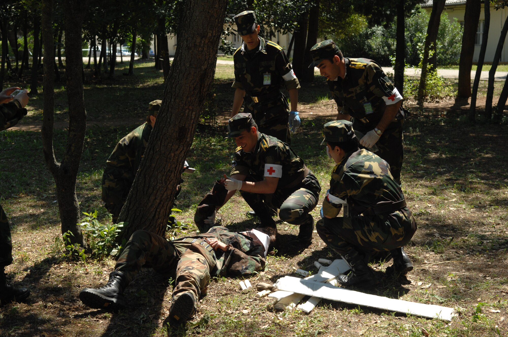 DIVULJE TRAINING BASE, Croatia – Cadets from the Military Medicine Faculty of the Armenian Medical University perform Combat Life Saver skills on a moulage patient May 12 during the mass-casualty exercise portion of the 2008 Medical Training Exercise in Central and Eastern Europe (MEDCEUR).  The mass-casualty exercise applies the knowledge troops gained during MEDCEUR training.  Fifteen nations are participating in the exercise from May 2 through 14. The exercise focuses on mass-casualty training scenarios and humanitarian aid in response to crises situations. MEDCEUR is a Joint Chiefs of Staff regional/multilateral exercise sponsored by U.S. European Command. Croatia is hosting the 2008 exercise which has drawn about 400 multi-nationals in support of the Partnership for Peace initiative. (U.S. Air Force photo/Staff Sgt. Kristin Ruleau) 