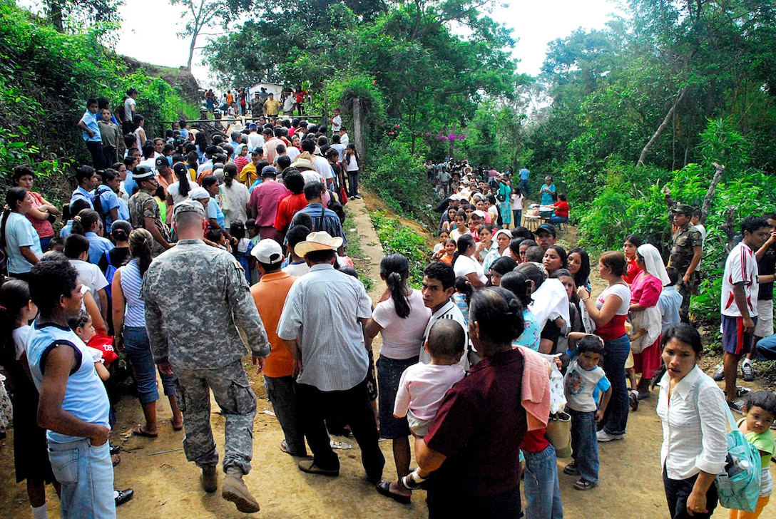 Salvadorans await entrance to a school near Comasagua, El Salvador, May 8, 2008, during Fuerzas Aliadas Humanitarias 2008, a medical exercise sponsored by the U.S. Southern Command and Salvadoran Ministry of Defense throughout the Central American region, May 5 -15, 2008. More than 1,600 Salvadorans received medical, dental, and eye care, as well as medication and public health instruction.