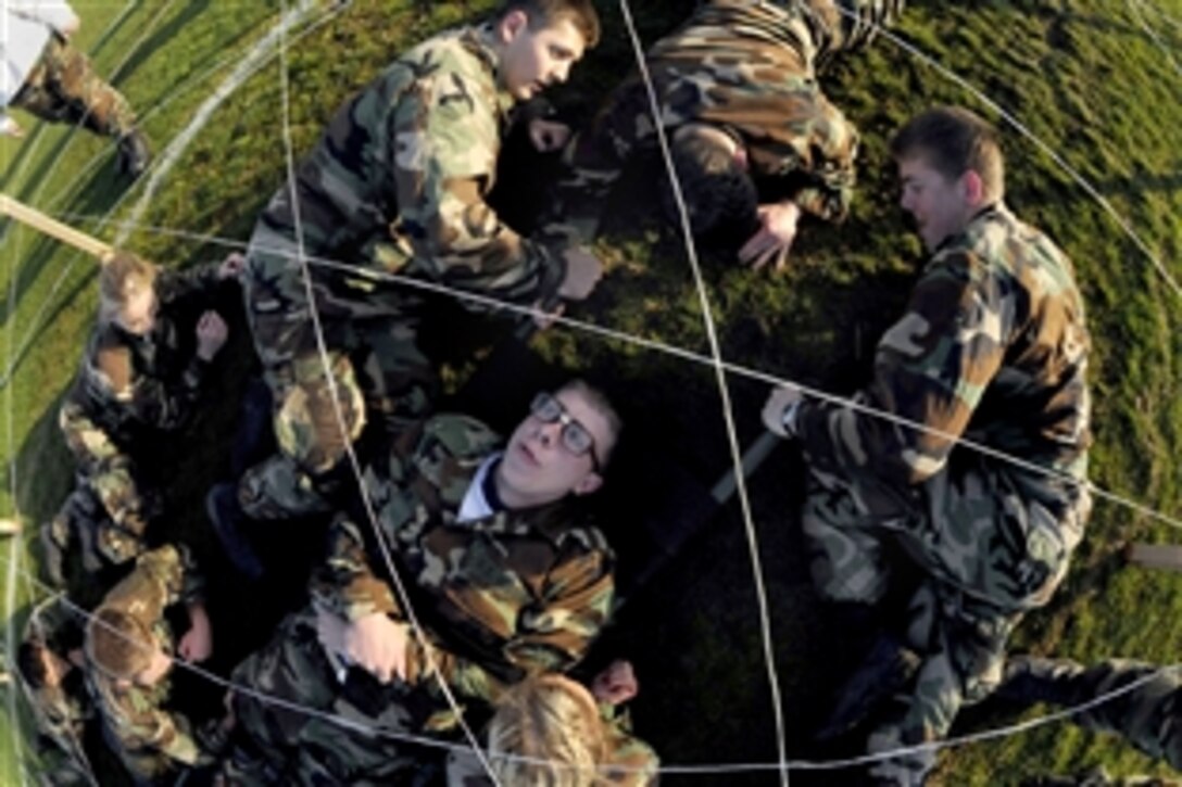 U.S. Naval Academy plebes transport a simulated casualty through an obstacle course on Farragut Field during Sea Trials, a rite of passage for plebes to test teamwork and mental stamina, marking the end of their freshman year at the academy in Annapolis, Md., May 13, 2008. 