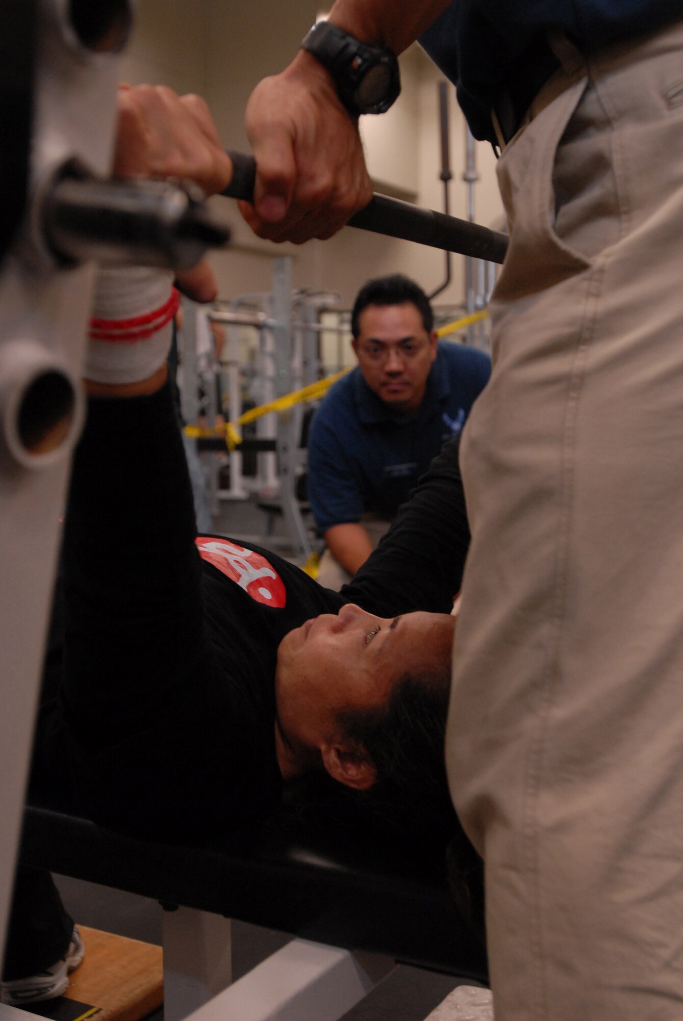 Hirono Arihama prepares for an attempt in the bench press competition at the Risner Fitness Center while spotter Choji Kamoya assists. Ms. Arihama, a Marine Corps Community Services employee assigned to Camp Foster, claimed the top spot in the women’s competition.
(U.S. Air Force photo/Staff Sgt. Darnell Cannady)