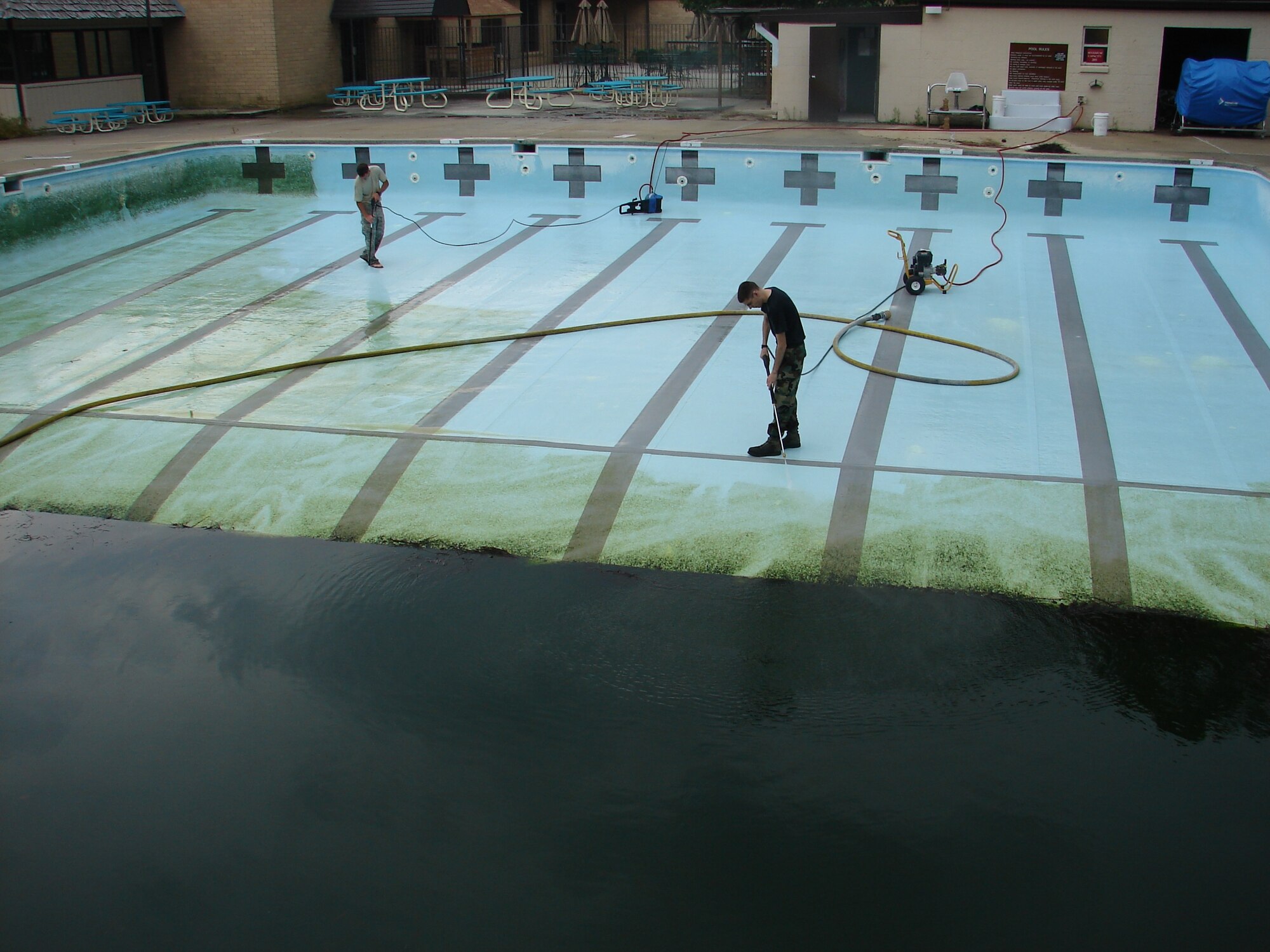 Airman 1st Class James Founds and Senior Airman Thomas Wooten, both 43rd Civil Engineer Squadron, clean the Pope Pool in preparation for opening day, which is May 23. Staff Sgts. David Tripp and Kyle Hanshew, 43rd CES, also helped to get the pool ready. The Pope Pool hours are Tuesday through Friday 11 a.m. to 7 p.m. and Saturday, Sunday and holidays from noon to 7 p.m. The Combat Control School Pool will also be open for “Military Training” Tuesday and Thursday 6 to 8:30 a.m and “Military Lap” swim Tuesday through Friday 11 a.m. to 1 p.m. For more information, call the 43rd Services Squadron at 394-4386. (U.S. Air Force Photo by Maj. Erik Lagerquist)