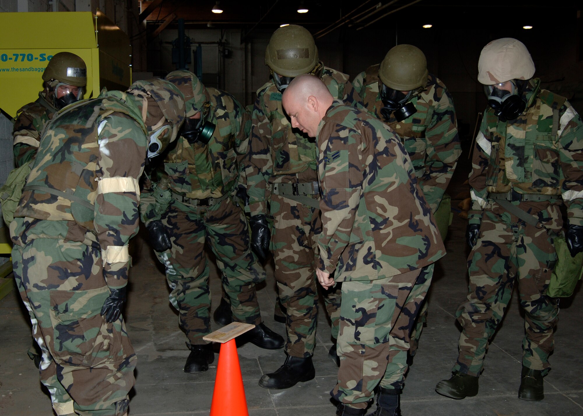 MCCONNELL AIR FORCE BASE, Kan. -- Airman 1st Class Arval Hawkins, 22nd Civil Engineering Squadron Readiness, emergency management flight, teaches his Chemical, Biological, Radiological, Nuclear, and Explosive class about liquid detection points and how to distinguish possible contaminants, May 13. (Photo by Airman Justin Shelton)