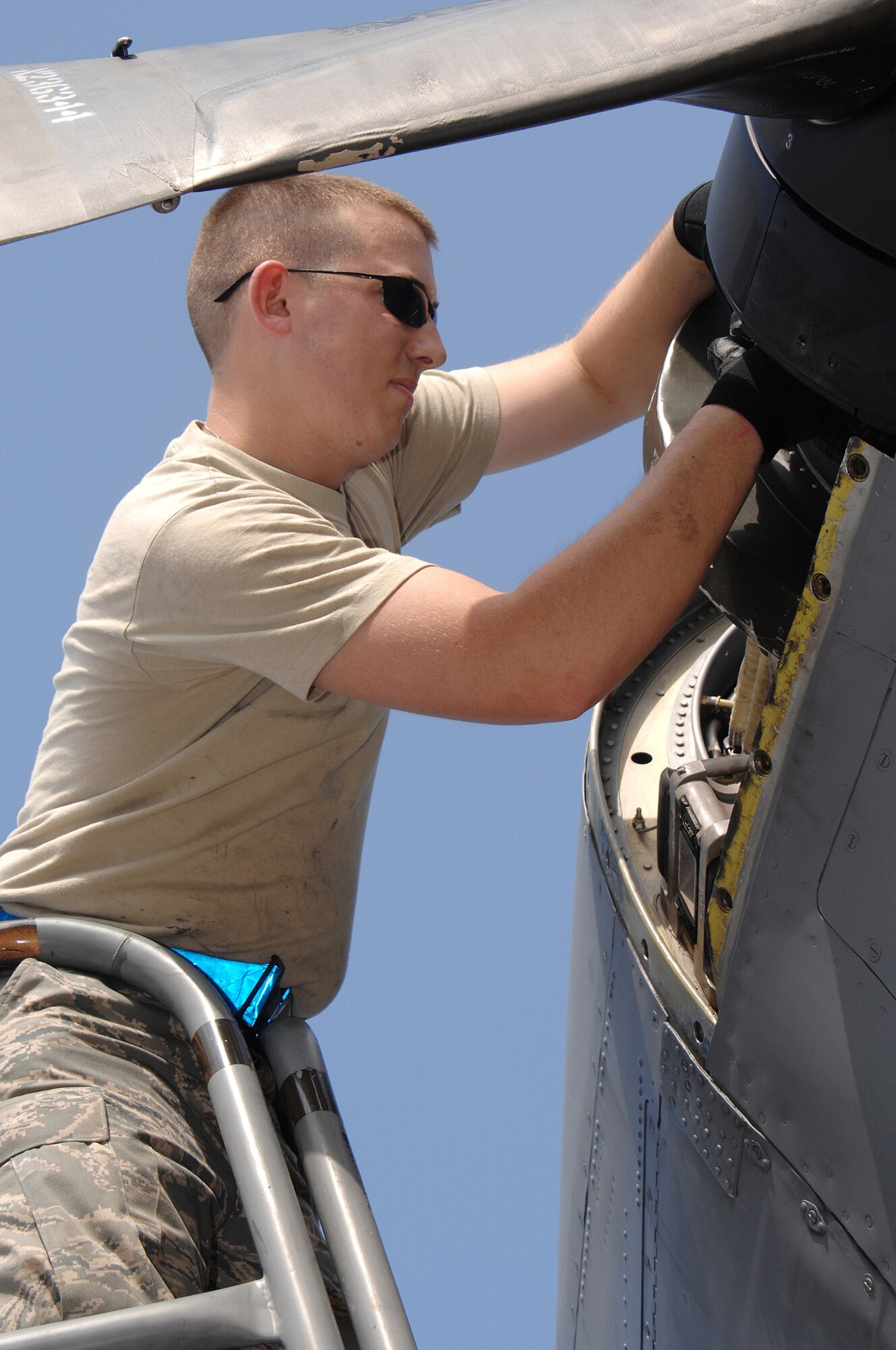 UTAPAO, Thailand - Airman 1st Class Stuart Coble, performs a propeller service inspection on a U.S. Air Force C-130 Hercules after its arrival from delivering relief supplies in Burma May 14. Airman Coble is with the 374th Aircraft Maintenance Squadron from Yokota Air Base, Japan. The Airmen are deployed in support of Operation Caring Response. (USAF photo by Senior Airman Sonya Croston)