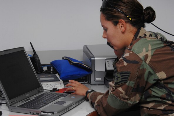UTAPAO, Thailand - Staff Sgt. Blanca Hernandez, 36th Contingency Response Group, coordinates incoming and outgoing flights from Utapao International Airport as part of humanitarian relief efforts to Burma May 14. Sergeant Hernandez is one of 45 members forward deployed from Andersen Air Force Base, Guam in support of Operation Caring Response. (USAF photo by Senior Airman Sonya Croston)