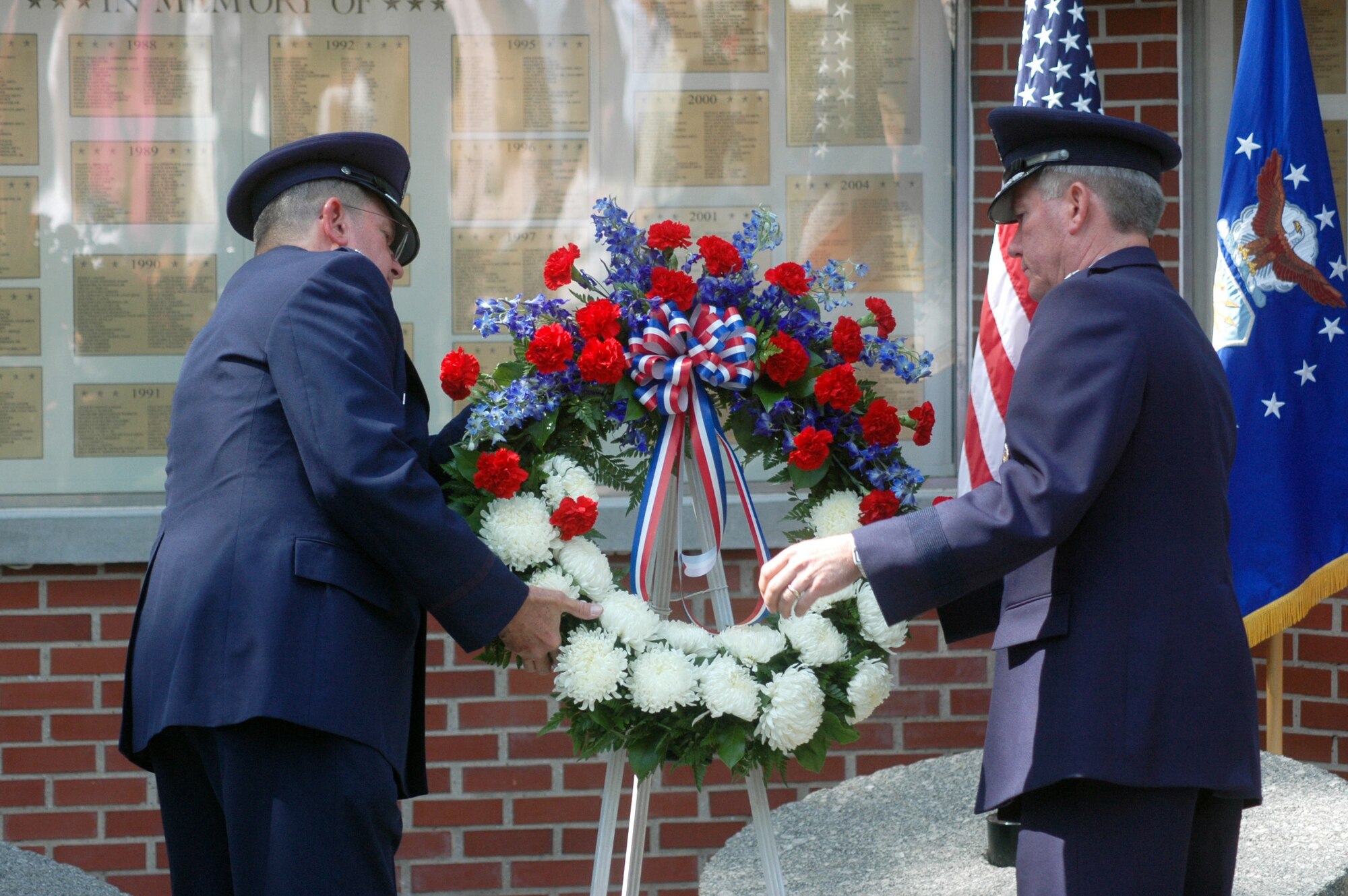 Chaplain (Lt. Col.) Thomas J. Fey and Maj. Gen. Tom Owen place a wreath at the 2007 Camellia Garden Memorial Ceremony. U. S. Air Force photo by Sue Sapp