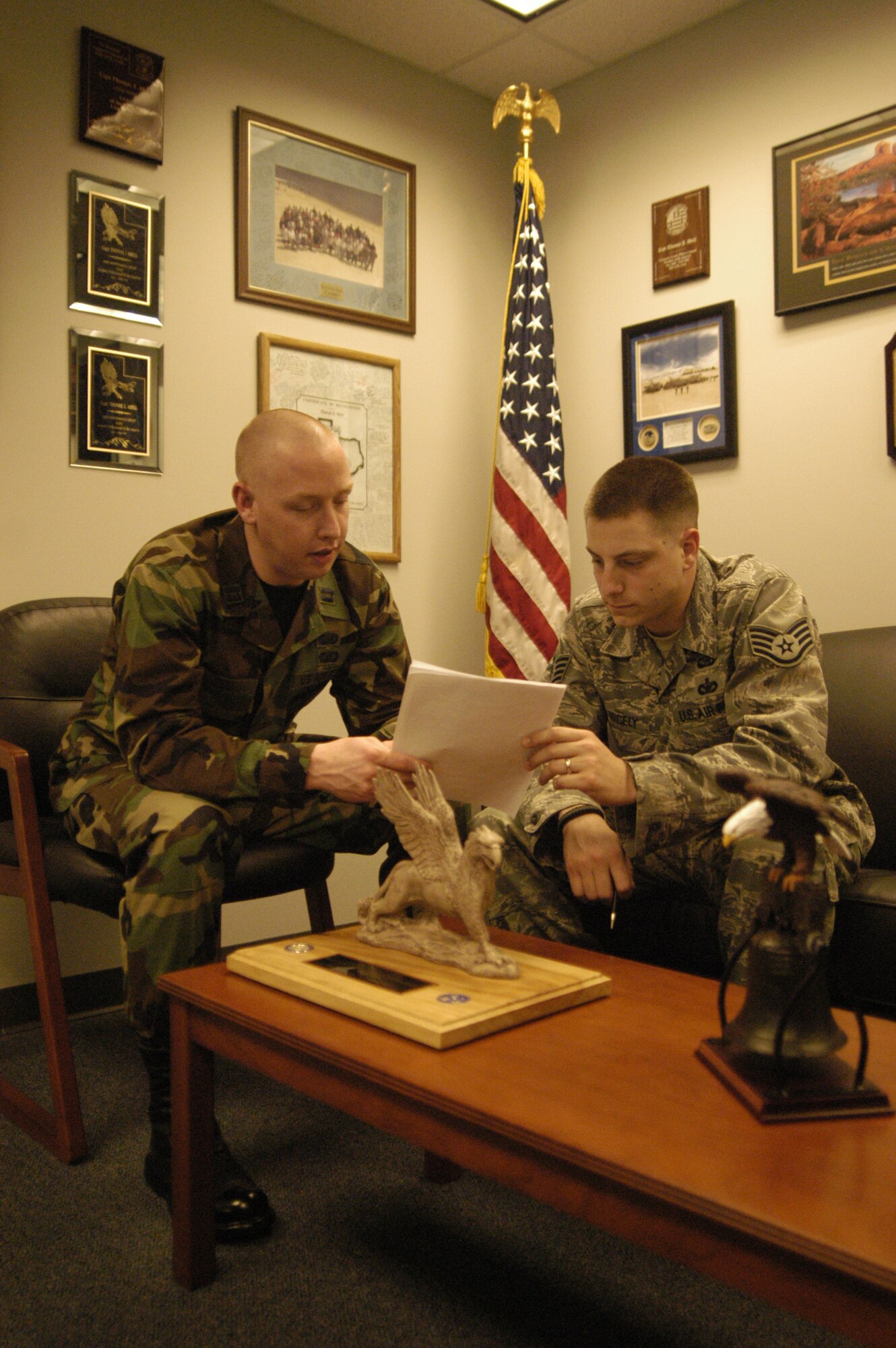 Capt. Thomas Abell, 436th Mission Support Squadron Military Personnel Flight commander, discusses process improvements with Staff Sgt. Brandon Nicely, 436th MSS assistant NCO in-charge of force management, to improve customer service. (U.S. Air Force photo/Airman 1st Class Shen-Chia Chu)
