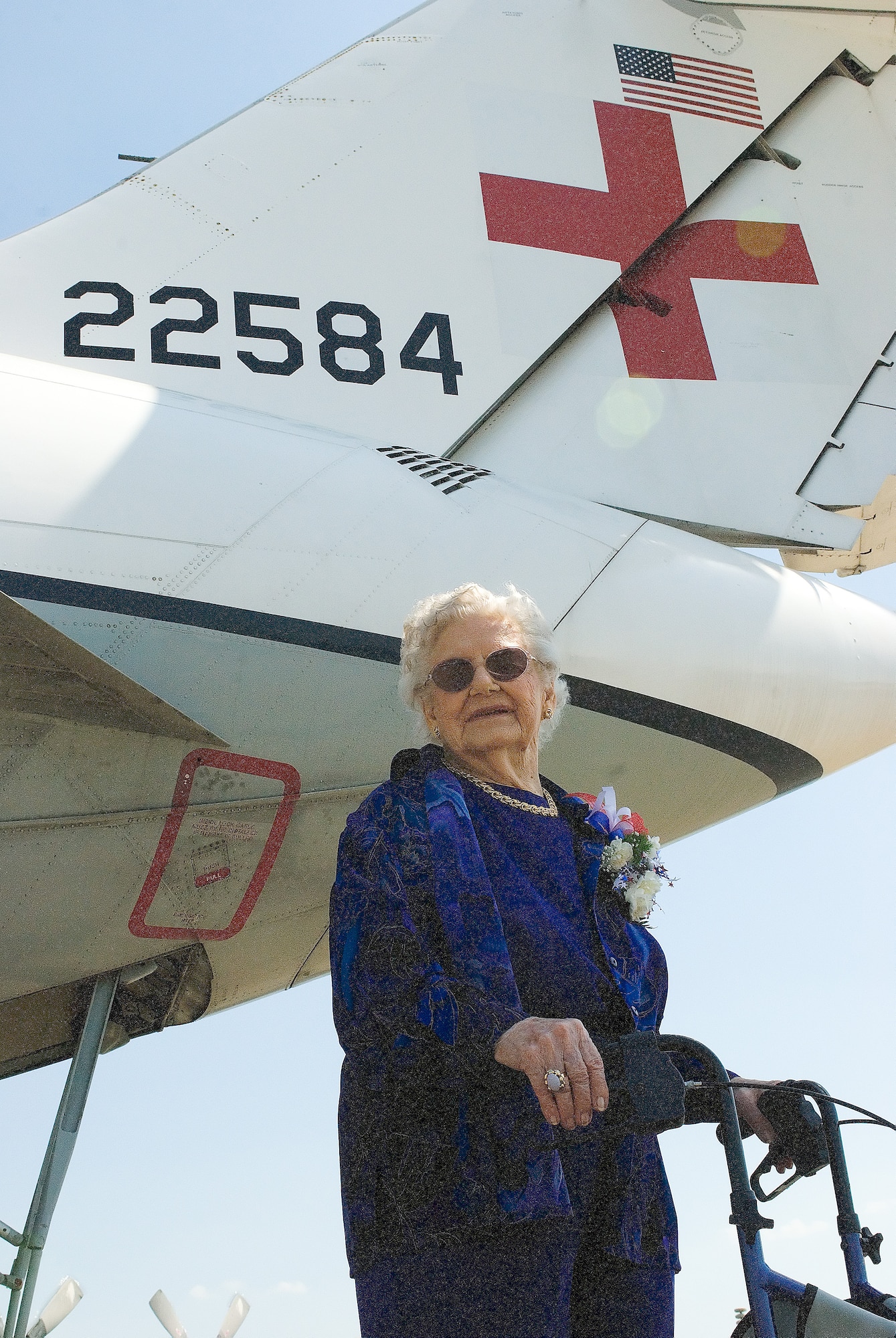 Dorothy Lewis visits a C-9A Nightingale outside the Air Mobility Command Museum. The AMC Museum honored this 92-year-old heroine for donating her dress uniform and bronze star during a ceremony May 9. (U.S. Air Force photo/Roland Balik)