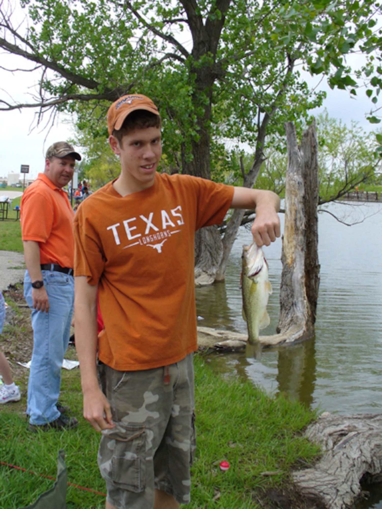 MCCONNELL AIR FORCE BASE, Kan. -- Seth Dugger, a Team McConnell family member, holds up his catch from the annual Fishing Derby held at Twin Lakes golf course, May 10.  The derby is one of the many events the 22nd Services Squadron hold to give Team McConnell members a chance to spend time with family members.