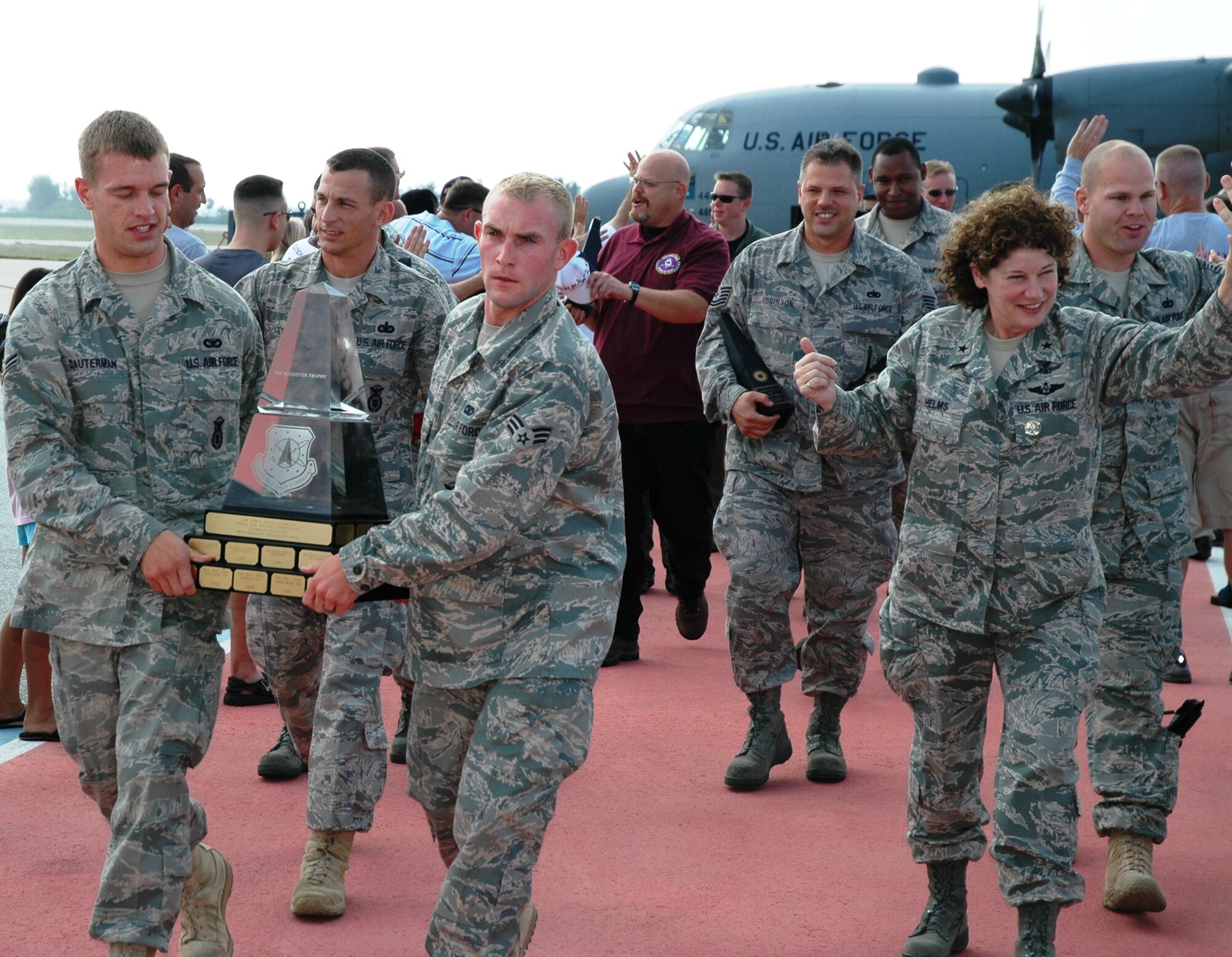 A fired-up group of Sharks, led by Brig. Gen. Susan Helms, bring home the trophy for the third straight time May 10 on the Patrick flightline. (U.S. Air Force photo by Chris Calkins)