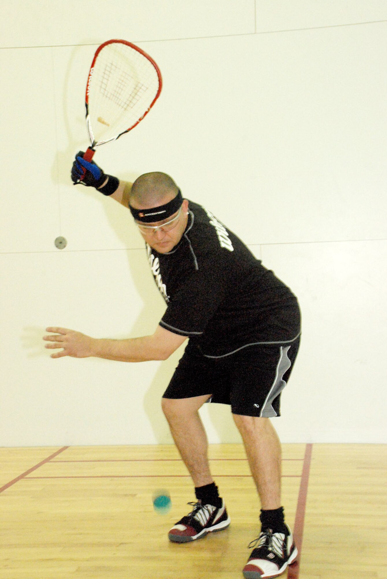 Master Sgt. Alfredo Suendermann, 90th Medical Support Squadron, practices racquetball in the Freedom Hall Fitness Center May 8. Sergeant Suendermann was recently selected for the Air Force racquetball team (Photo by Tech. Sgt. Kurt Arkenberg).