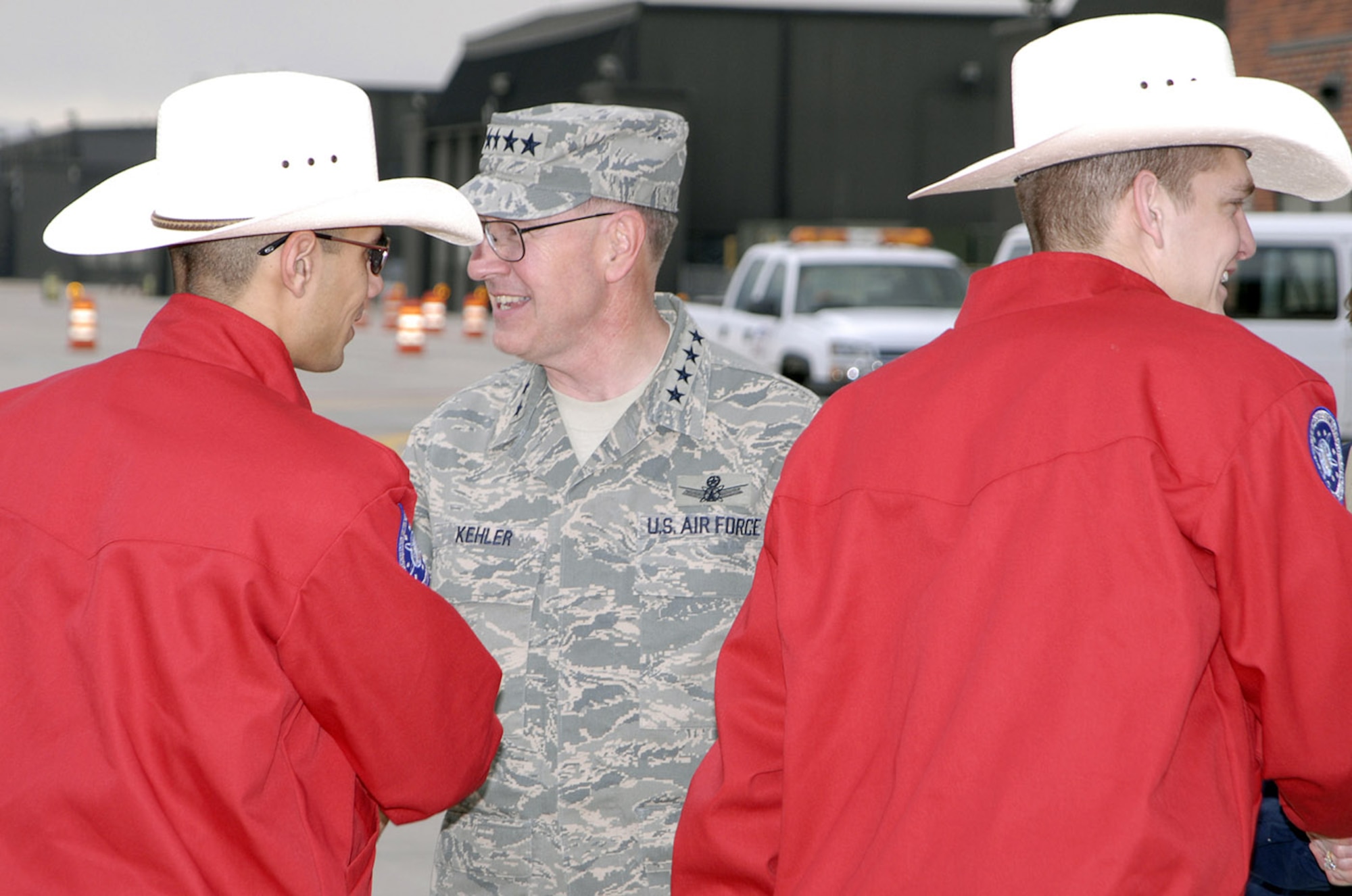Members of the 90th Space Wing are greeted by Gen. C. Robert Kehler, Air Force Space Command commander, May 7 on the Peterson Air Force Base,Colo., flightline. The teams prepared for three days of Guardian Challenge events, including a golf tournament, space and missile forum and awards banquet May 9. The GC competition pits the command’s space and missile wings against each other to see who’s the best in areas of expertise, including security forces, communications, missile combat or satellite operations. Warren’s Guardian Challenge team scored 4020 points, but lost to the Grizzlies at Malmstrom Air Force Base, Mont., with 4111 points.  Congratulations to our sister wing to the north for a back-to-back Blanchard trophy win. “I was honored to have participated with such a dedicated team,” said Col. Mike Morgan, 90th Space Wing commander. “They worked hard, as did all the project officers, trainers, mascots, and those that supported the effort in some fashion.  They all represented the Mighty Ninety exceptionally well.  Please pat them all on the back when you see them” (Photo by Dennis Howk)