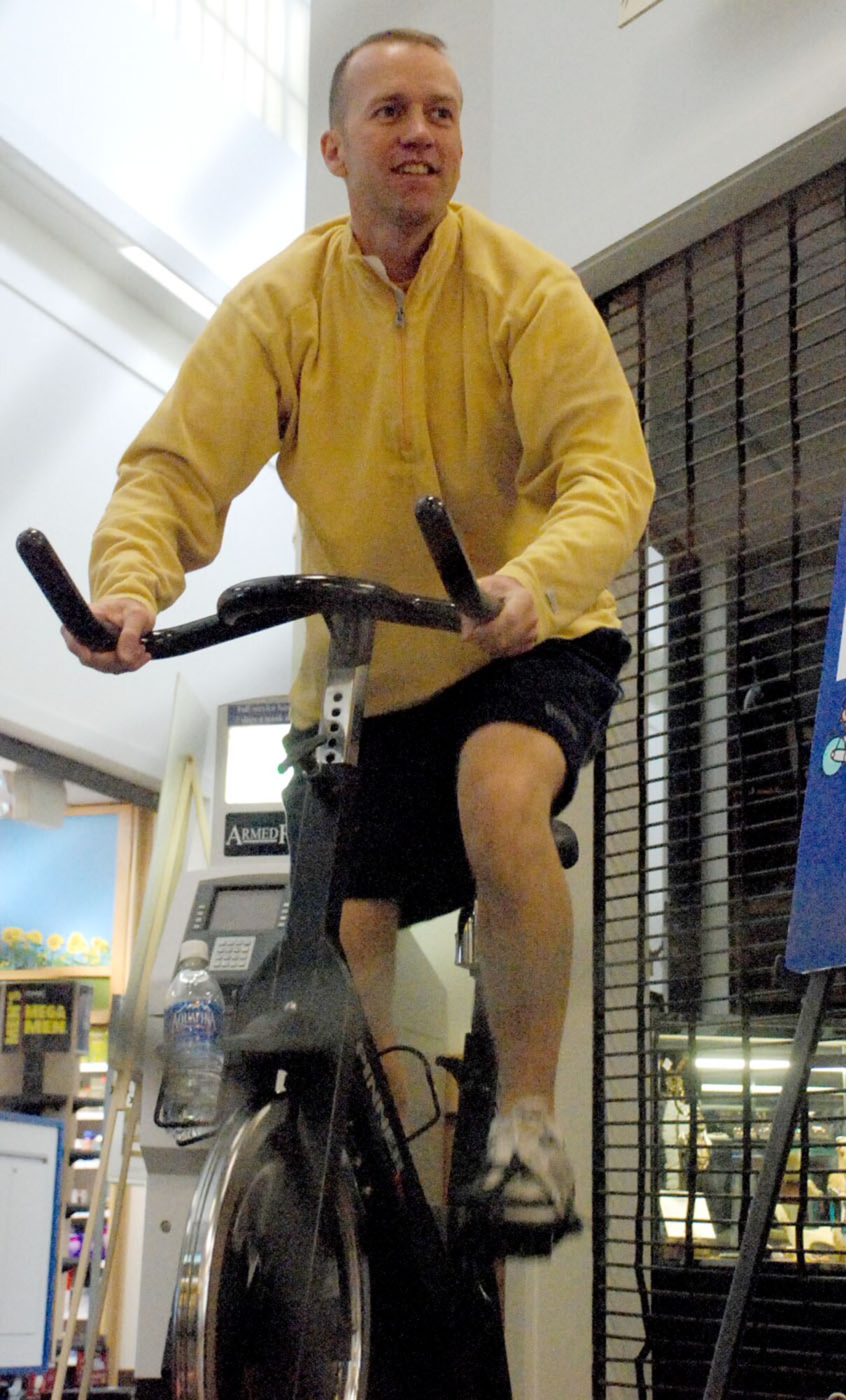 Master Sgt. Del Areford, 90th Force Support Squadron first sergeant, completes the first leg of the spin-a-thon competition for May Fitness Month. Sergeant Areford represented the 90th Mission Support Group during the event. During the spin-a-thon portion of the competition participants had to increase and decrease the pace and resistance they were riding. The change in speed and resistance was to simulate hills during the event.