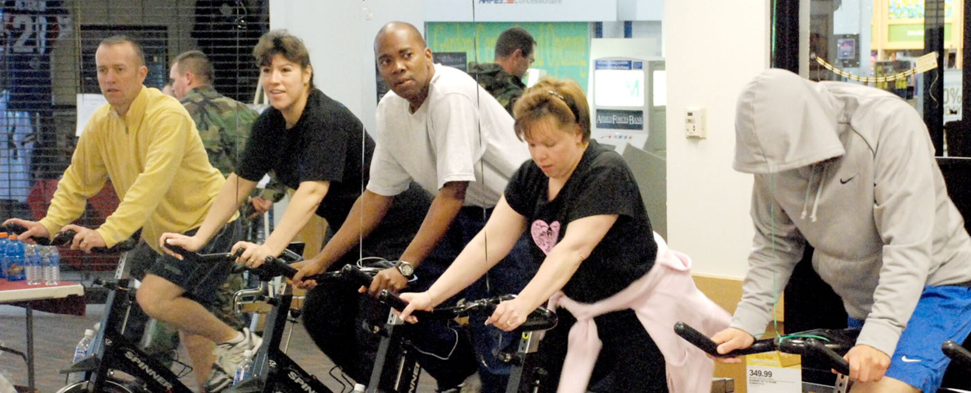 May Fitness Month began with a spin-a-thon relay in the Base Exchange May 2. Maintenance, mission support, medical, security forces, and 90th Space Wing staff all had representatives that pedaled throughout the day (Photos by Staff Sgt. Chad Thompson).