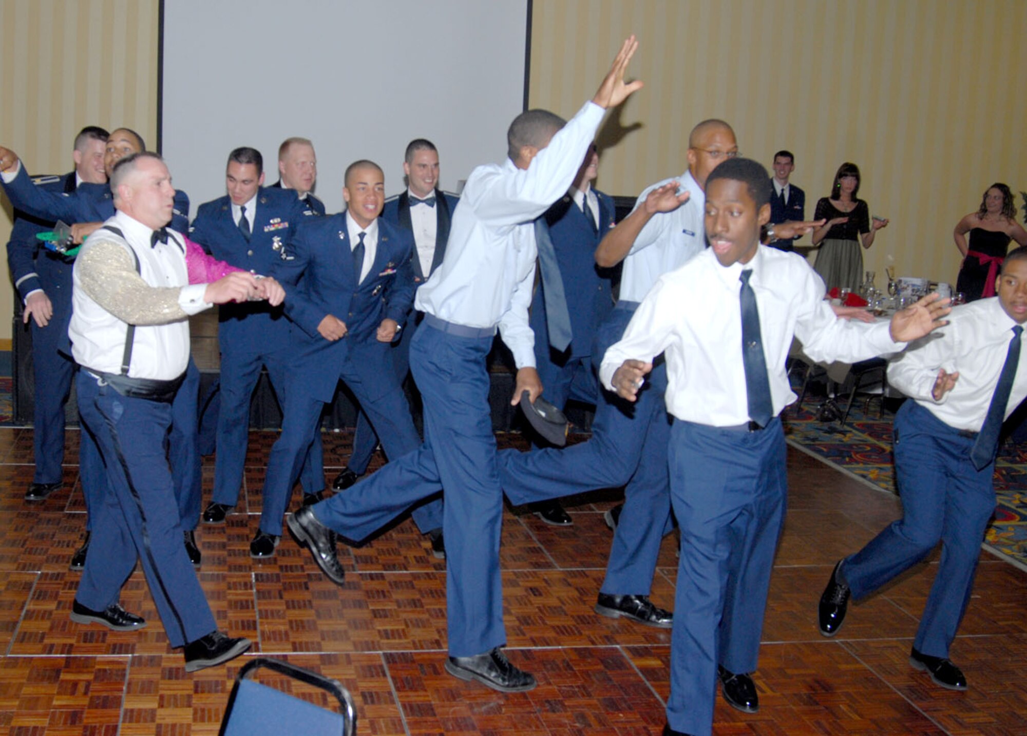 Col. David Martinez, 90th Security Forces Group commander, performs the “Soulja Boy” with security forces Airmen during the dance of the dining-out.