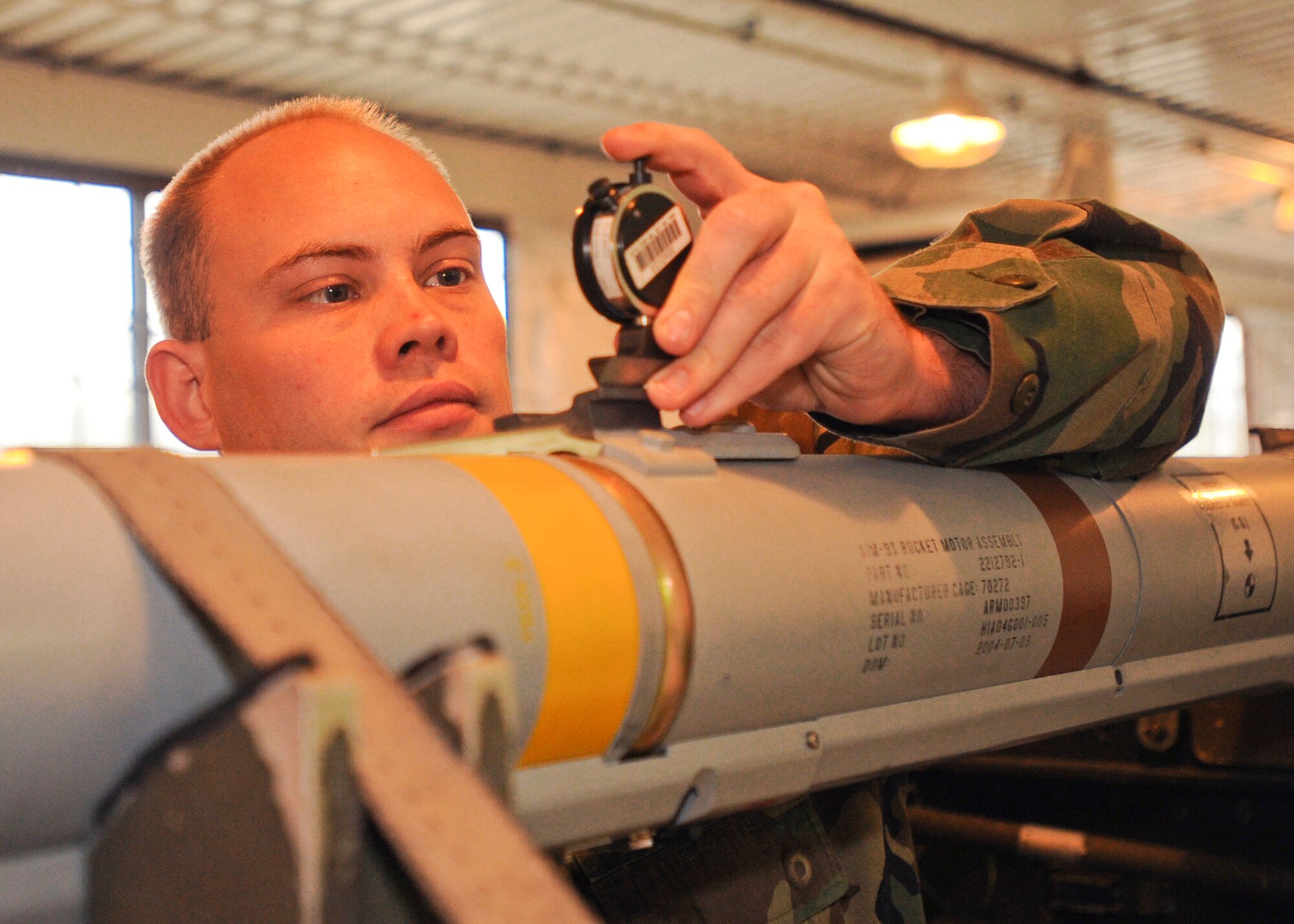 Staff Sgt. Wayne Zuiderhof, 3rd Equipment Maintenance Squadron Munitions Flight, checks the depth value on the forward hanger of a weapon Wednesday. Sergeant Zuiderhof was one of two recipients of the 2007 AIM-9X Cutting Edge Award. (U.S. Air Force photo by Airman 1st Class Laura Turner)