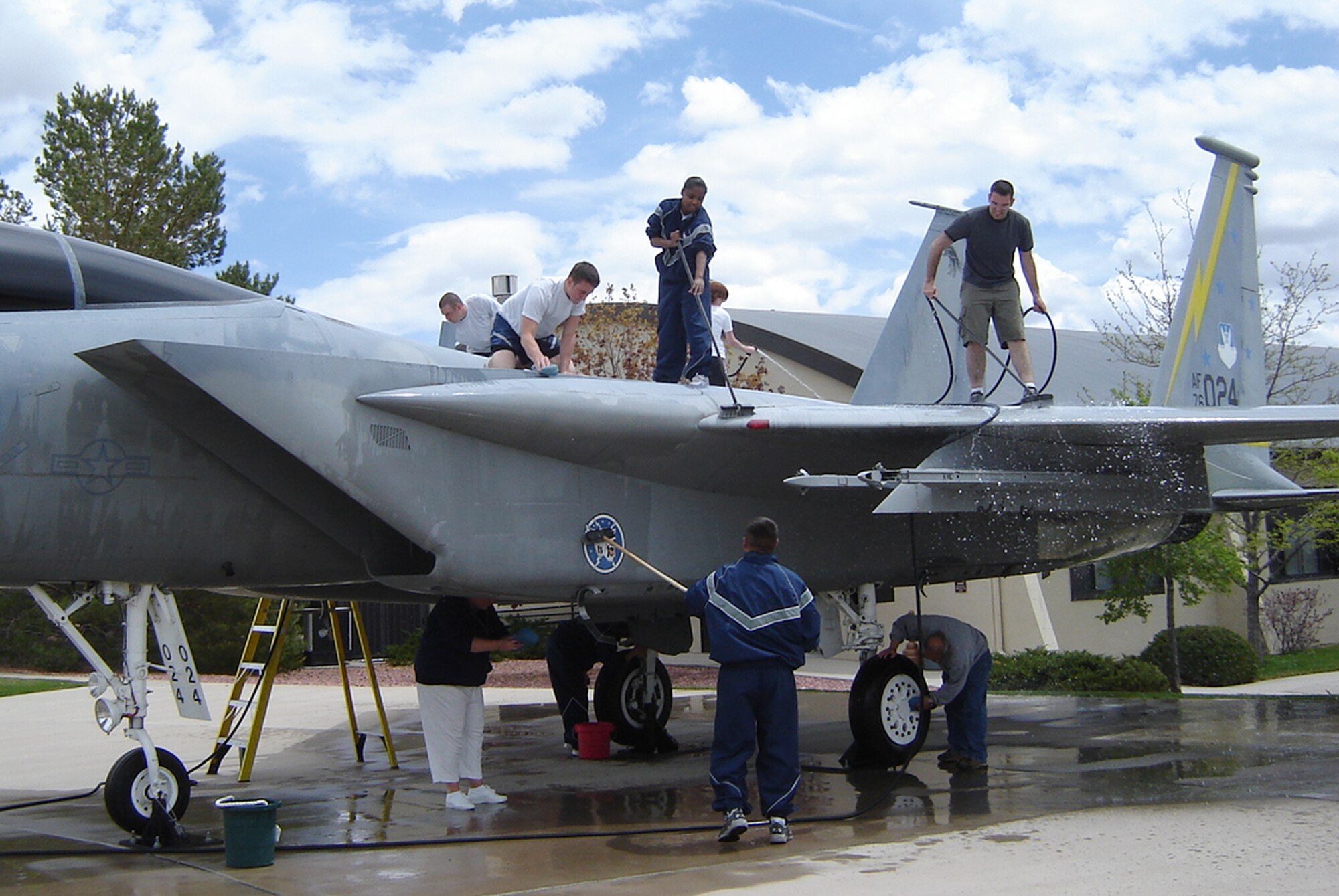 Members of the 21st Aerospace Medicine Squadron begin their second season supporting the Air and Space Museum's "Adopt-A-Plane" program May 14 at Peterson Air Force Base, Colo. The squadron adopted the museum's F-15 "Eagle" in 2007, and assists museum staff in care and maintenance of the aircraft with regular cleanings. Team Peterson organizations interested in adopting a museum aircraft or missile can contact Jeff Nash at 556-8314. (U.S. Air Force photo/Jeff Nash)
