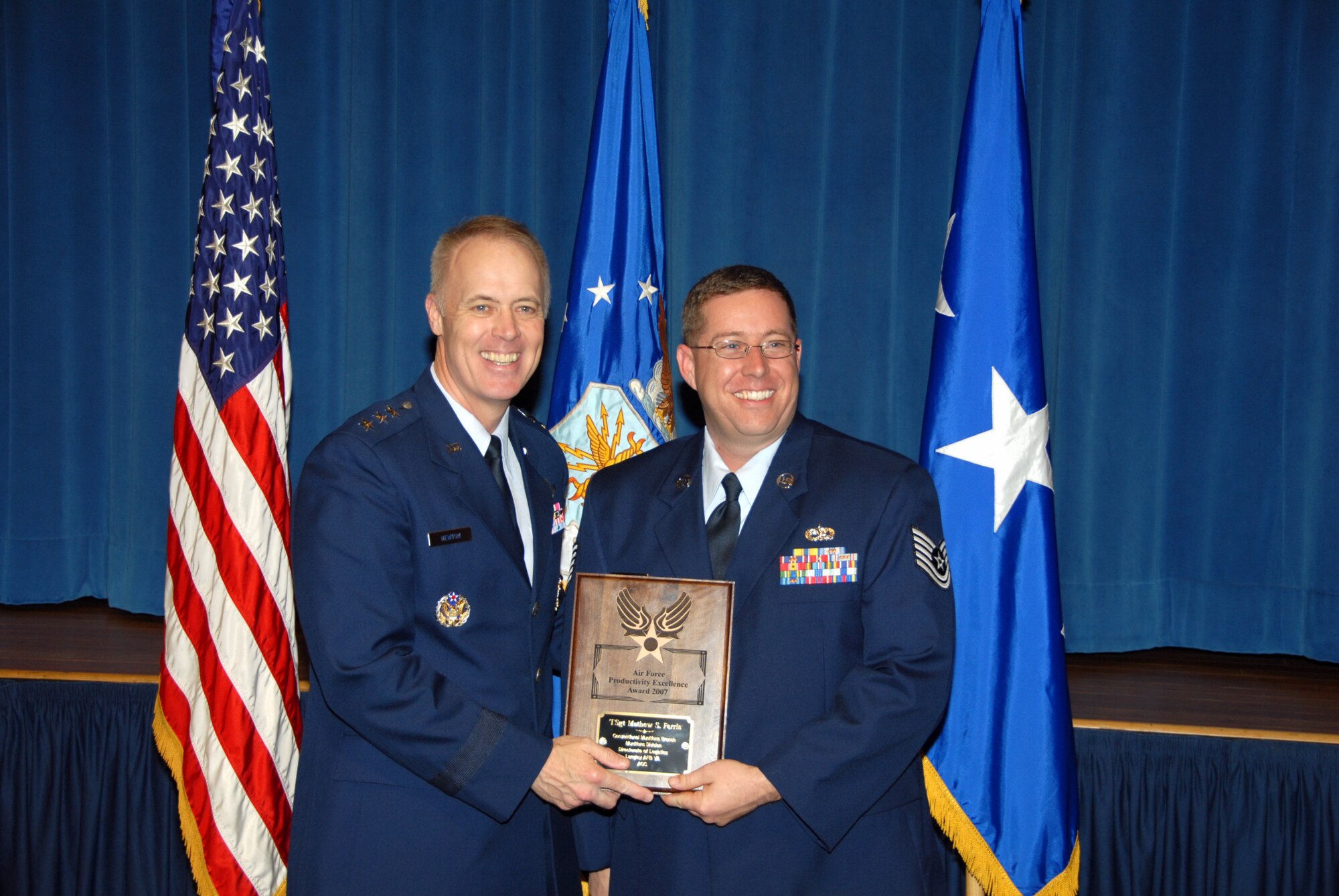 LANGLEY AIR FORCE BASE, Va. -- Lt. Gen. Richard Newton III presents Tech. Sgt. Mathew Ferris with the Air Force Productivity Excellence Award at the Pentagon April 8. (Courtesy photo)