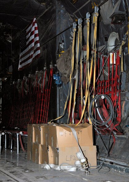Several hundred thousand leaflets to be airdropped over an Iraqi city are strapped down with the static lines running from the leaflet boxes up to the anchor cable of a C-130 Hercules during an airdrop mission recently. The anchor cable is also used by paratroopers when jumping from the aircraft in-flight and the static line is designed to rip open their parachute once they've cleared the aircraft and is pulled back in for reuse. (U.S. Air Force photo/Tech. Sgt. Michael O'Connor) 