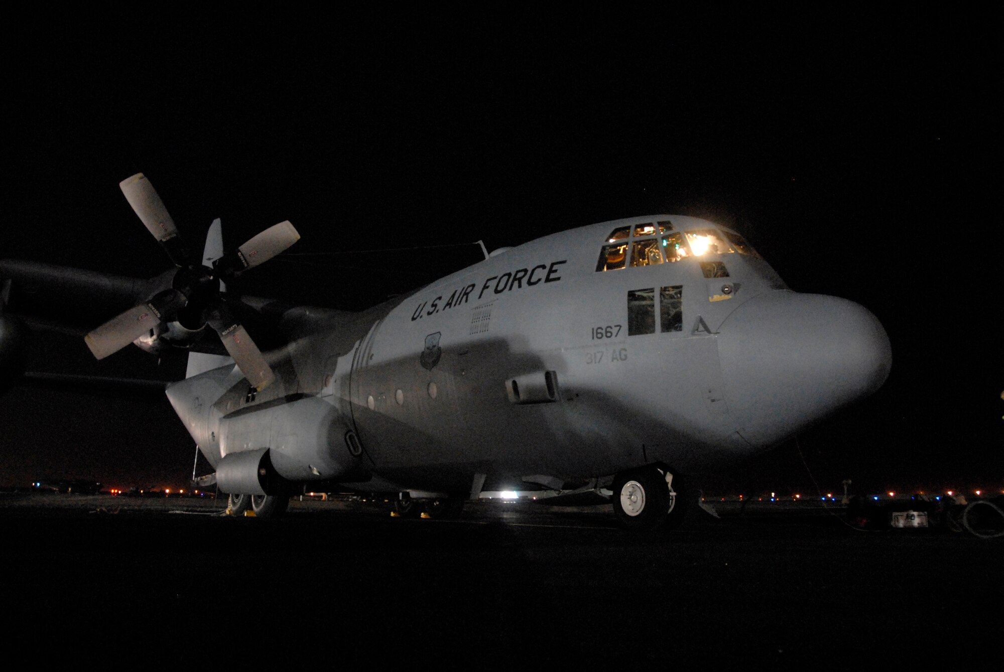 SOUTHWEST ASIA -- A Dyess Air Force Base C-130 Hercules assigned to the 737th Expeditionary Airlift Squadron awaits its crew, passengers and cargo May 13, 2008, before being flown on a mission into Iraq from an air base in the Persian Gulf Region. The 737th EAS is assigned to the 386th Air Expeditionary Wing which received and processed out more than 330,000 passengers, 48,000 tons of cargo, baggage and mail, onboard more than 8,200 C-130 and C-17 Globemaster III missions during the Air and Space Expeditionary Force 1 and 2 rotation which first arrived to the air base in Jan. 2008. (U.S. Air Force photo/Tech. Sgt. Michael O'Connor)