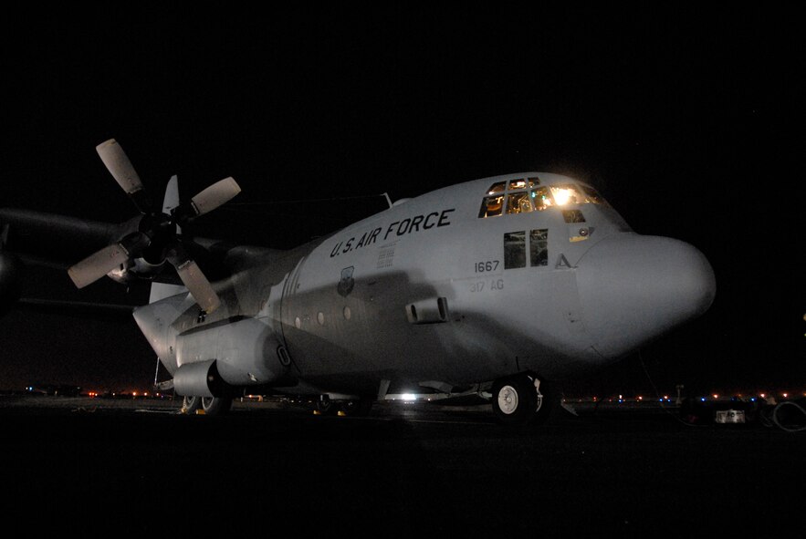 SOUTHWEST ASIA -- A Dyess Air Force Base C-130 Hercules assigned to the 737th Expeditionary Airlift Squadron awaits its crew, passengers and cargo May 13, 2008, before being flown on a mission into Iraq from an air base in the Persian Gulf Region. The 737th EAS is assigned to the 386th Air Expeditionary Wing which received and processed out more than 330,000 passengers, 48,000 tons of cargo, baggage and mail, onboard more than 8,200 C-130 and C-17 Globemaster III missions during the Air and Space Expeditionary Force 1 and 2 rotation which first arrived to the air base in Jan. 2008. (U.S. Air Force photo/Tech. Sgt. Michael O'Connor)
