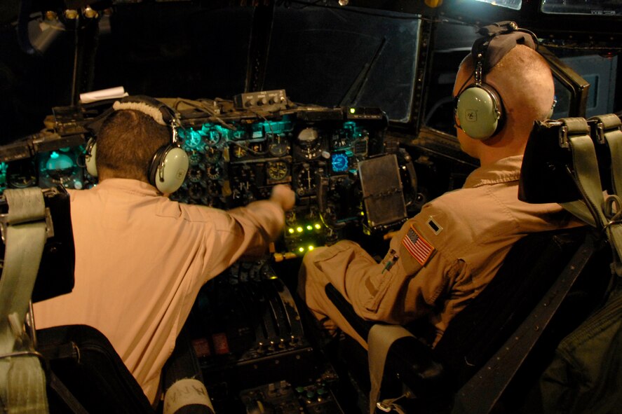 SOUTHWEST ASIA -- Staff Sgt. James Rice, an Air Force C-130 Hercules engineer and 1st Lt. Justin Fitzpatrick, a co-pilot with the 737th Expeditionary Airlift Squadron, go through a pre-flight checklist to ensure all the control and pressure guages are working on the instrument panel prior to the aircraft's departure on a passenger/cargo mission to Iraq on May 13, 2008. Both Lieutenant Fitzpatrick and Sergeant Rice are deployed from Dyess Air Force Base, Texas. (U.S. Air Force photo/Tech. Sgt. Michael O'Connor)