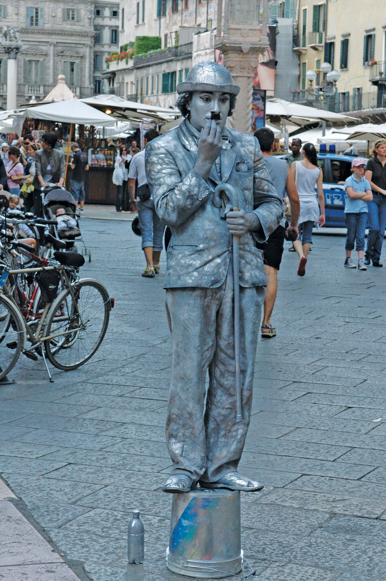 VERONA, Italy--An Italian man impersonates Charlie Chaplin's character "The Tramp" in the center of Verona May 10. The Tramp, as portrayed by Chaplin, is a bumbling but usually good-hearted character who is most famously presented as a vagrant who endeavors to behave with the manners and dignity of a gentleman despite his actual social status. (U.S. Air Force photo/Senior Airman Justin Weaver).