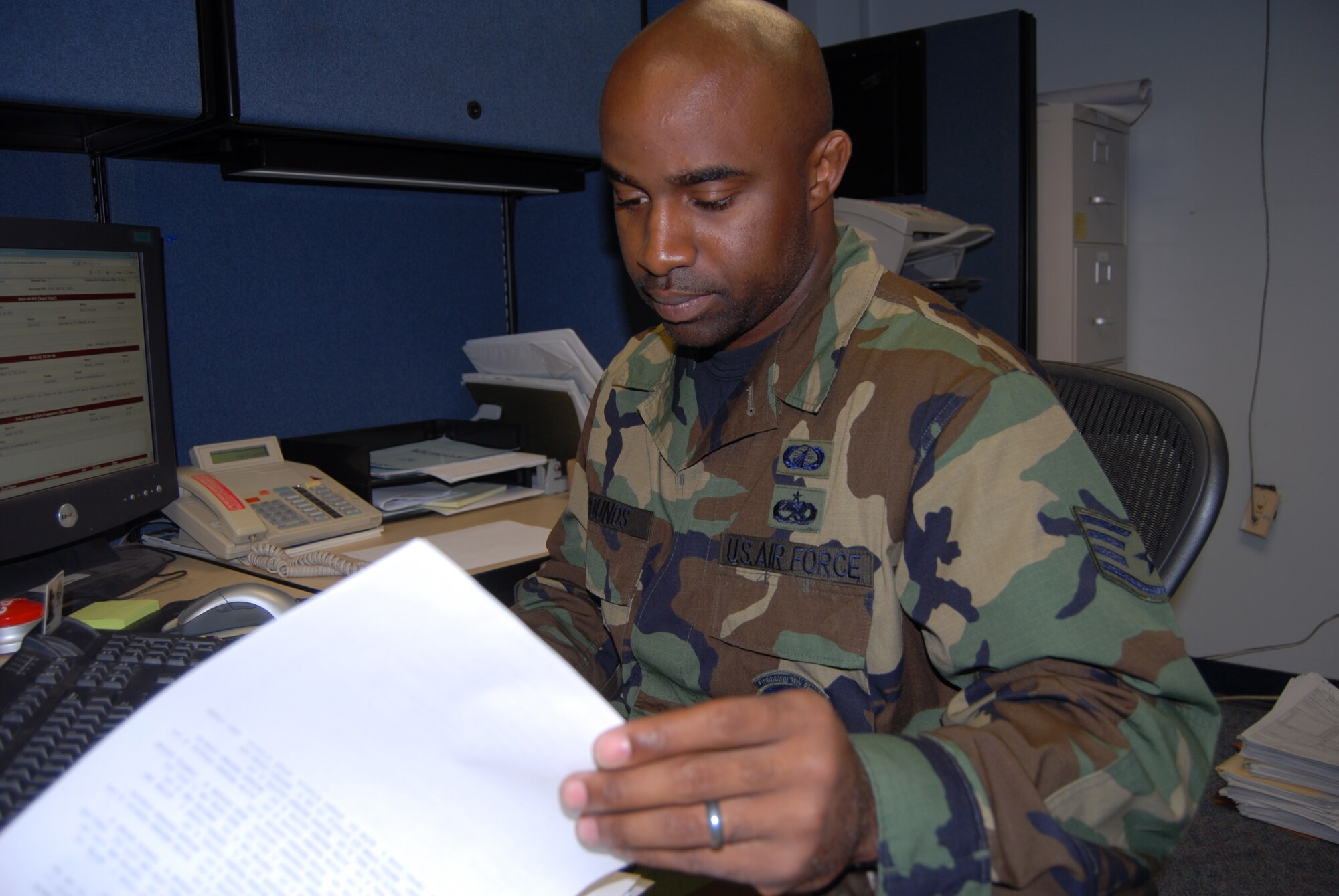Staff Sgt. Anthony Pounds, 43rd Comptroller Squadron, reviews military pay records at the finance office Monday. (U.S. Air Force Photo by Airman 1st Class Mindy Bloem)