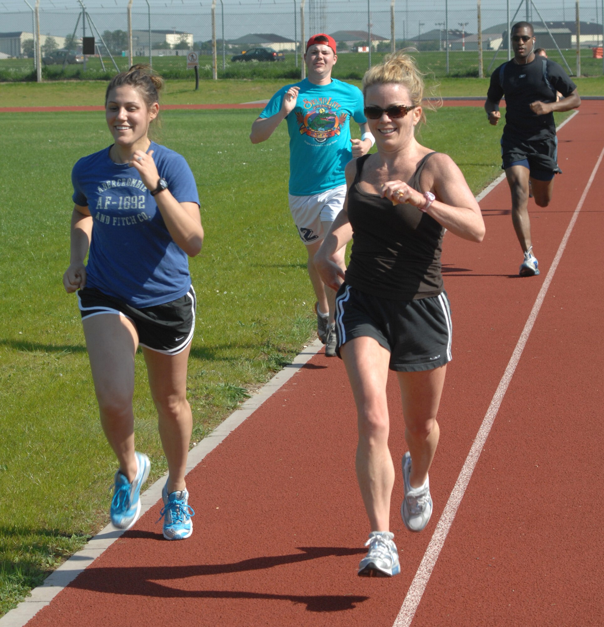 Airman 1st Class Savanna Wadtke, left, and Karen Hoffman step it out during a meeting of the Team Mildenhall Running Club May 8 at the track at Heritage Park. The club meets at the Hardstand Fitness Center Tuesdays at 3:30 p.m. for an endurance run of 2-6 miles and every Thursday at the base track for speed work. Runners of all abilities and experience levels are welcome. For more information, contact 1st Lt. Anthonelli White at DSN 238-5873. (U.S. Air Force photo by Tech. Sgt. Eric Petosky)
