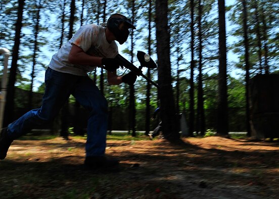 MOODY AIR FORCE BASE, Ga. -- Airman 1st Class Andrew Stout, 23rd Security Forces Squadron member, runs toward a bunker for cover during a paintball match here May 14. The paintball tournament, held at Splatter Swamp paintball range, was one of several events sponsored by the 23rd SFS as part of its Police Week observance. (U.S. Air Force photo by Airman 1st Class Brittany Barker) 
