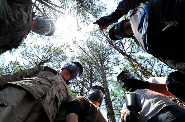 MOODY AIR FORCE BASE, Ga. -- Members of the 23rd Security Forces Squadron discuss strategy before playing a game of paintball here May 14. The 23rd SFS held a paintball tournament at Splatter Swamp paintball range as part of its observance of Police Week. (U.S. Air Force photo by Airman 1st Class Brittany Barker) 
