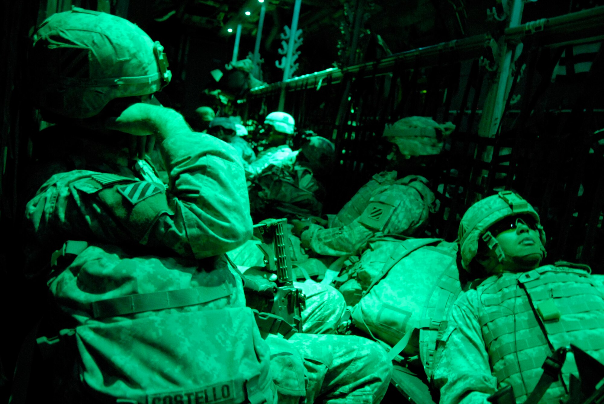 SOUTHWEST ASIA -- Army 1st Lt. John Costello (front left) and 1st Lt. Ruben Ramos (front right), take a power nap in the back of an Air Force C-130 Hercules after departing an air base in Iraq on May 13, 2008. The Soldiers are returning home from a 14-month-deployment in Iraq and are deployed from the A-Battery, 1-10 Field Artillery, 3rd Brigade Combat Team, 31st Division out of Fort Benning, Ga. (U.S. Air Force photo/Tech. Sgt. Michael O'Connor)