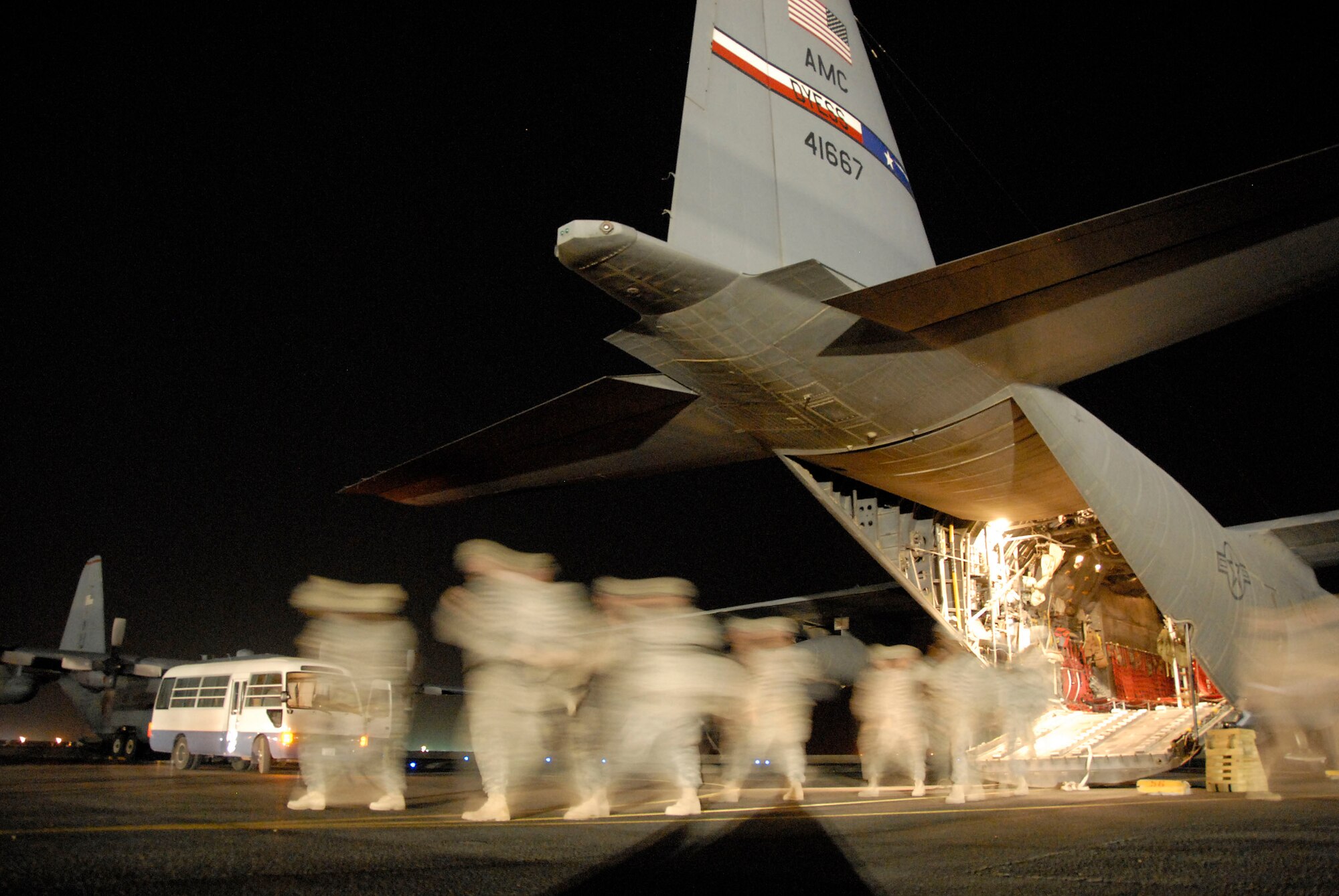 SOUTHWEST ASIA -- Soldiers returning home from a 14-month-deployment in Iraq step-off of an Air Force C-130 Hercules at an air base in the Persian Gulf Region May 13, 2008. The Soldiers are deployed from the A-Battery, 1-10 Field Artillery, 3rd Brigade Combat Team, 31st Division out of Fort Benning, Ga. (U.S. Air Force photo/Tech. Sgt. Michael O'Connor)