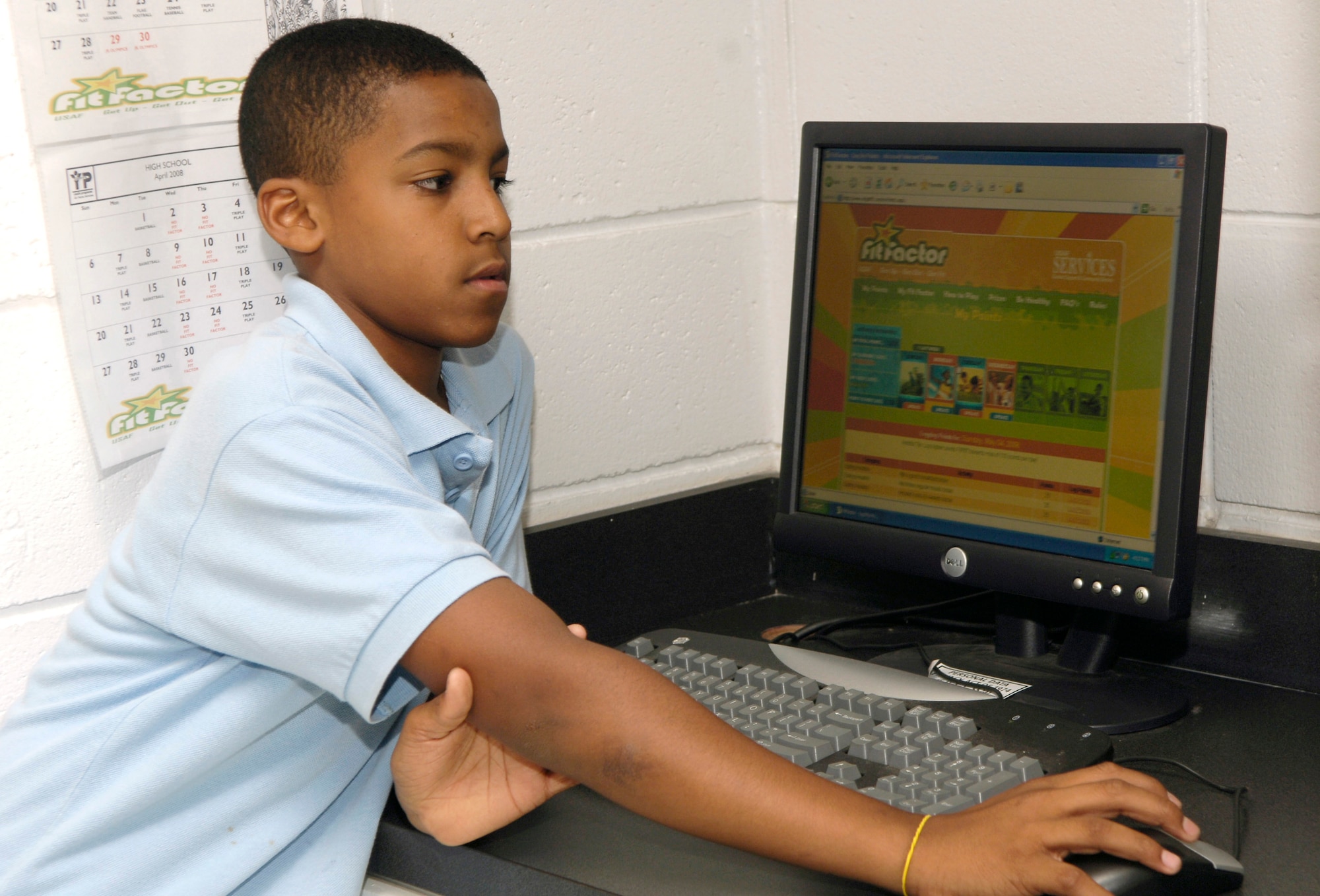 Anthony Hernandez logs into the Fitfactor website to enter his scores for the days activities May 8, at the youth center MacDill AFB. The fitfactor program was designed to get children more active and live healthier lives.