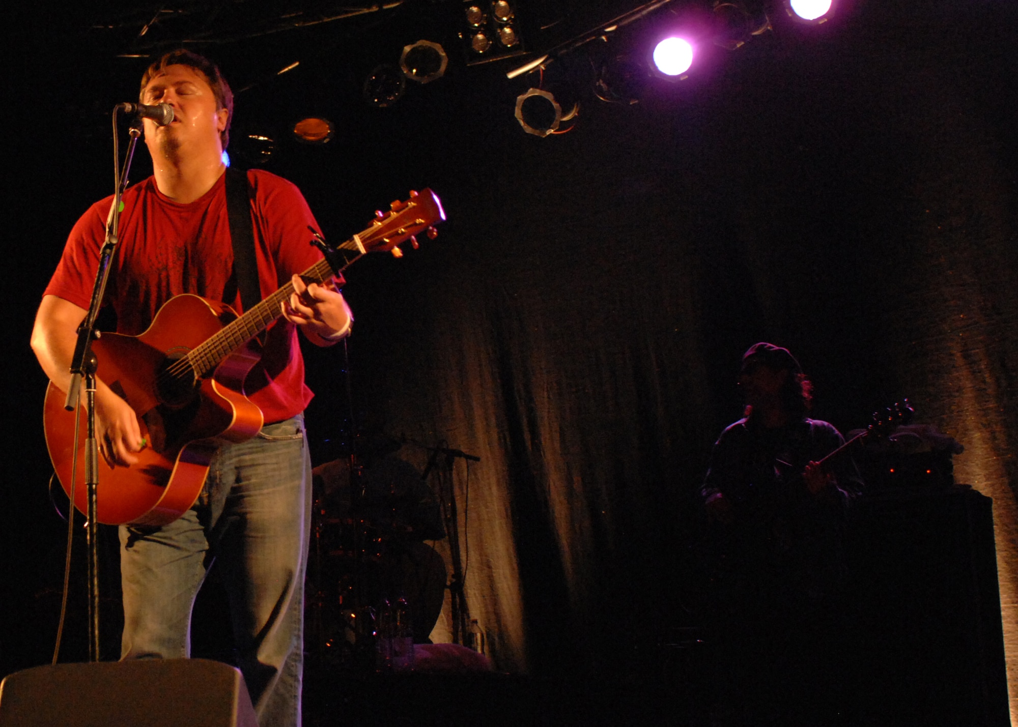 SPANGDAHLEM AIR BASE, Germany- Edwin McCain performs as Bass Guitarist Manny Yates plays in the background at the Skelton Memorial Fitness Center May 9, 2008. Edwin McCain performed his chart topping hit “I’ll Be” from his second album “Misguided Roses”. (U.S. Air Force Photo/Airman 1st Class Jenifer Calhoun)