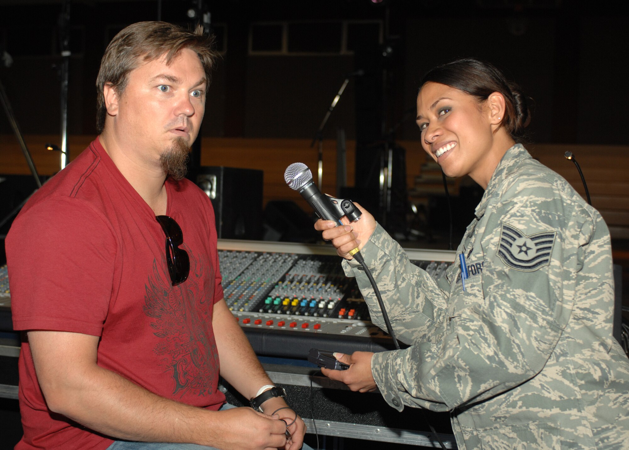 SPANGDAHLEM AIR BASE, Germany- Edwin McCain and Technical Sgt Szu- Muy Ruiz, Det 9 AFNEWS, enjoys a good laugh as they prepare for an interview at the Skelton Memorial Fitness Center May 9, 2008.  Edwin McCain performed a concert as part of the Armed Forces Entertainment Concert Series which brings big named performers to military installations and provides free entertainment to those serving in the military and their families. (U.S. Air Force Photo/Airman 1st Class Jenifer Calhoun)