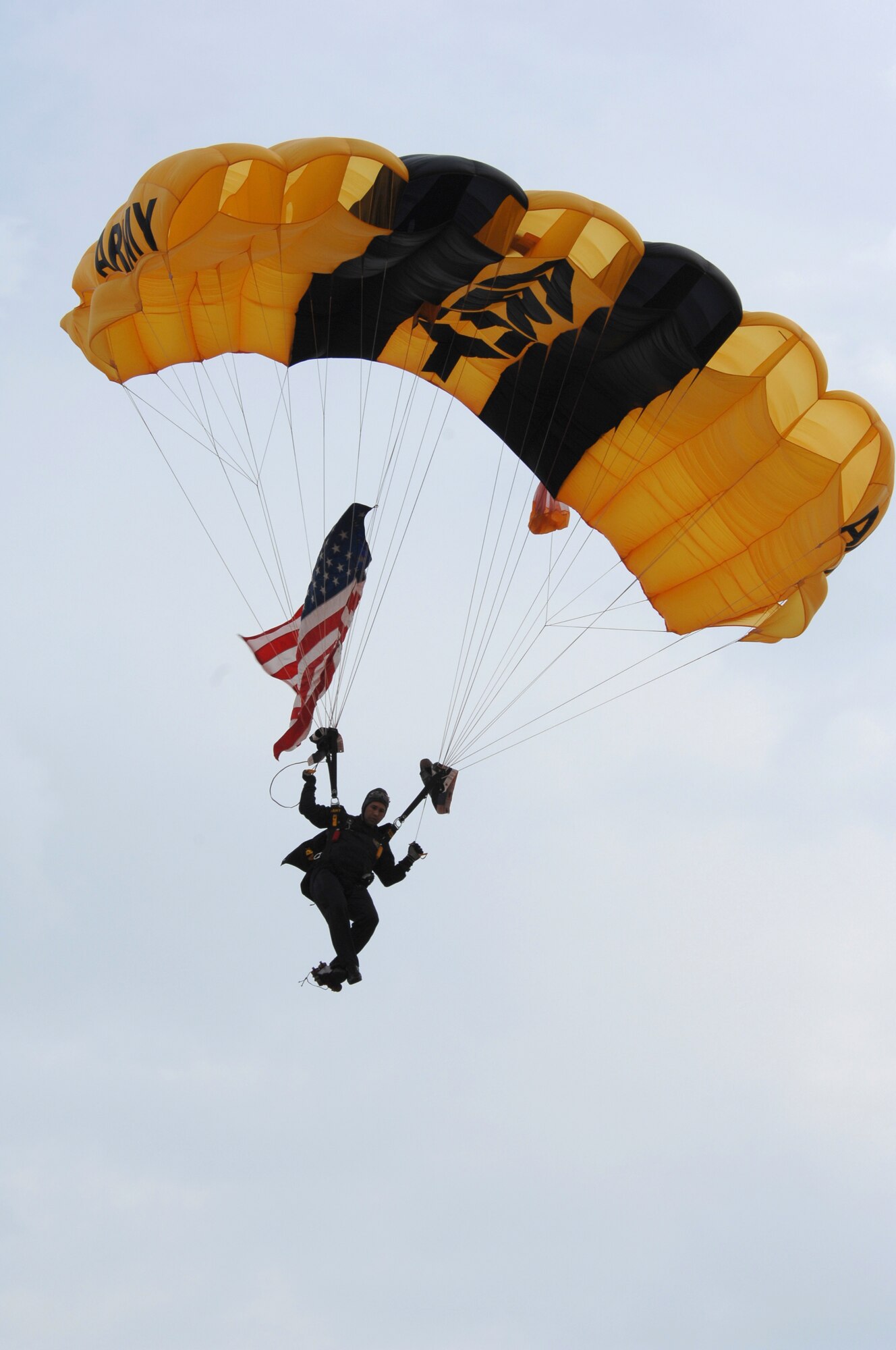 BARKSDALE AIR FORCE BASE, La. -- U.S. Army Staff Sgt. Howie Sanborn, Golden Knight Parachutist, escorts the U.S. Flag to the Barksdale Air Force Base flight line during the opening ceremony of the 2008 Defenders of Liberty Air Show.  The Air Show commemorates the 75th anniversary of Barksdale Air Force Base.  (U.S. Air Force photo by TSgt Laura K. Smith)