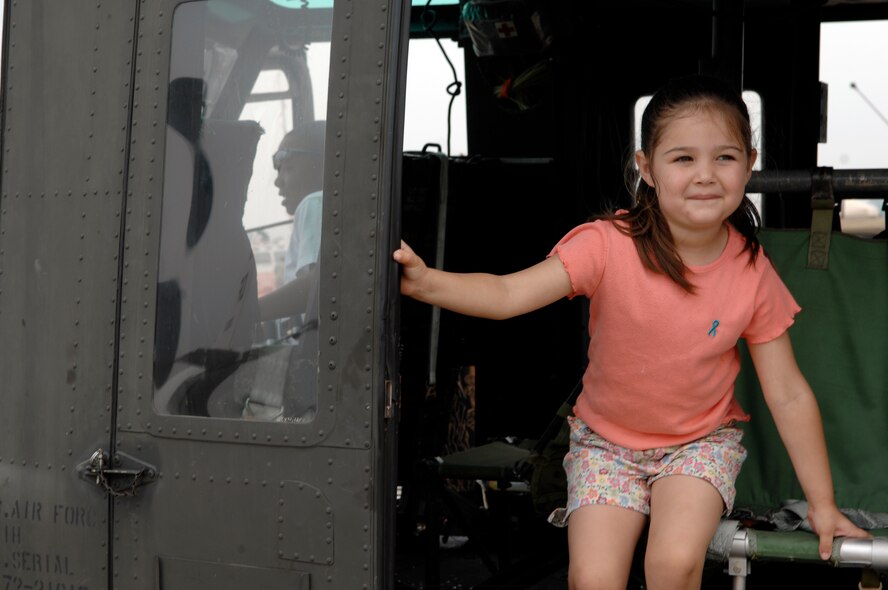 BARKSDALE AIR FORCE BASE, La. -- Zoe Garcia, 5, sits in the cockpit of a U.S. Air Force UH-1 Huey helicopter on the flight line of Barksdale Air Force Base, La. during the 2008 Defenders of Liberty Air Show.  The Air Show commemorates the 75th anniversary of Barksdale Air Force Base.  (U.S. Air Force photo by TSgt Laura K. Smith)