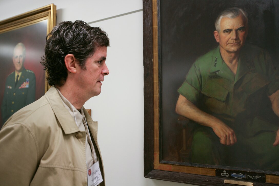 Douglass C. Henry, Jr., president of Henry Molded Products, Inc., based in Lebanon, Penn., looks at the portrait of Army Gen. William C. Westmoreland, during the Pentagon tour as part of the Marine Corps Business Executive Forum program. Henry met Moreland, who was Chief of Staff from 1968-1972. Headquarters, U.S. Marine Corps hosted 15 civilian business leaders for a day with Washington, D.C.-based Marine leaders May 16 designed to introduce civilian business leaders to the Marine Corps mission, current operations, and interests, as well as provide a forum for discussion between the executives and senior Marine leaders.