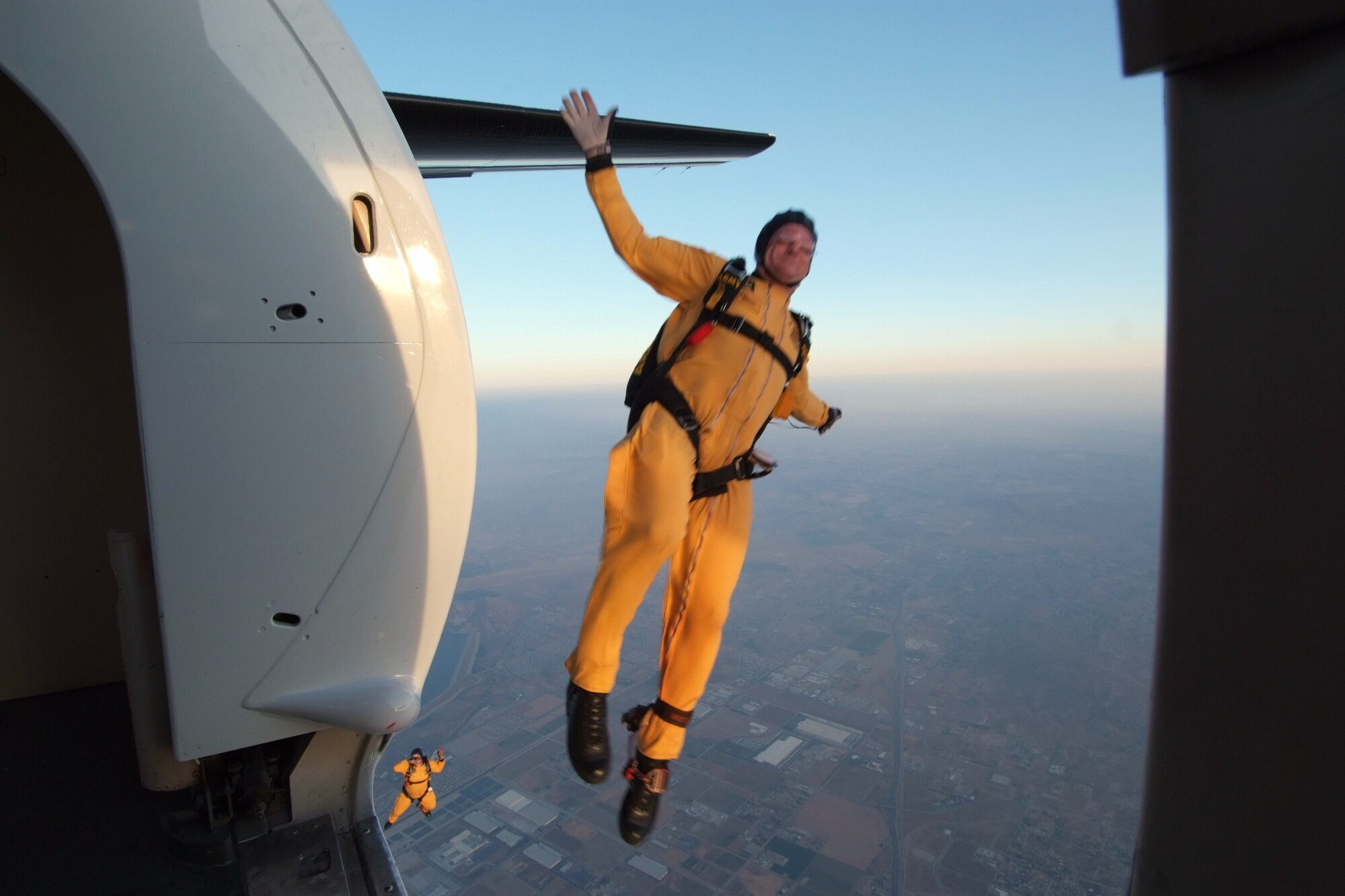 A member of the U.S. Army Golden Knights Parachute Team jumps out of a C-31 Fokker during an air show at March Air Reserve Base.  Dubbed "Thunder over the Empire", the  biannual airshow allows the civilian community the chance to interact with the military community.  (U.S. Air Force photo by TSgt Joe Zuccaro) 