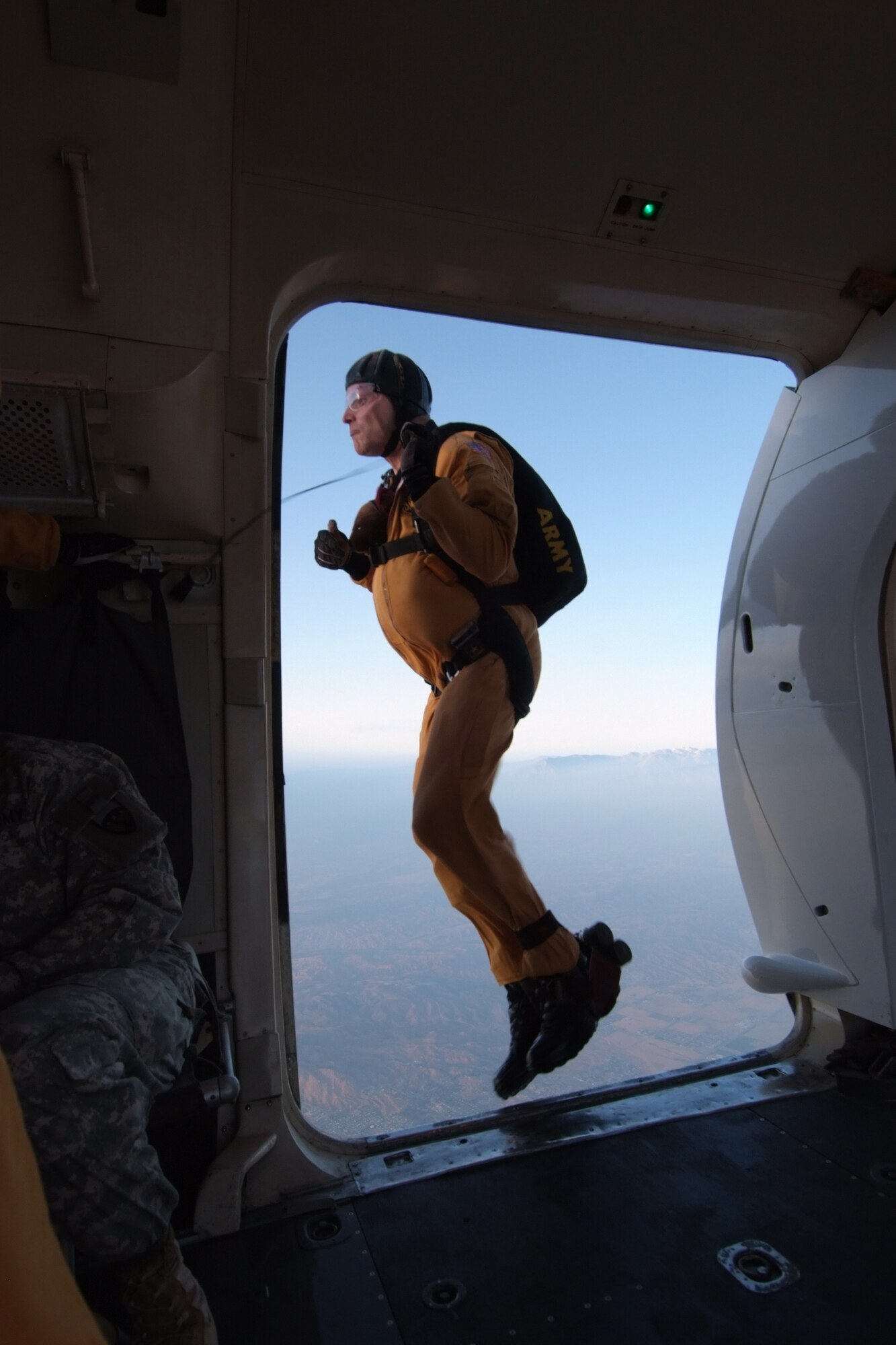 S1C Charles Cooley of the U.S. Army Golden Knights Parachute Team jumps out of a C-31 Fokker during an air show at March Air Reserve Base.  Dubbed "Thunder over the Empire", the  biannual air show allows the civilian community the chance to interact with the military community.  (U.S. Air Force photo by TSgt Joe Zuccaro) 
