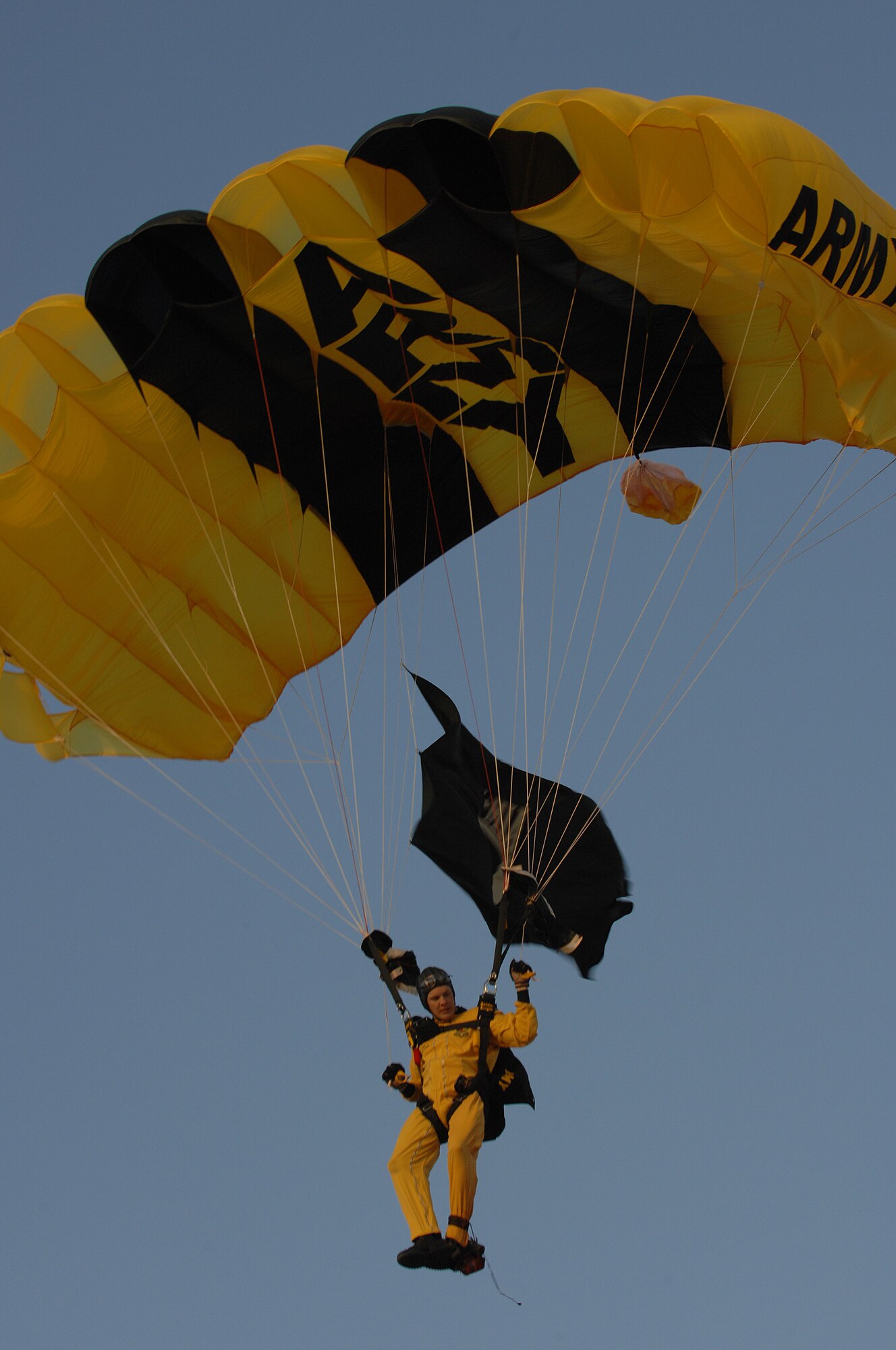 U.S. Army Sgt. Dan Cook, a demonstration parachutist with the Golden Knights from Fort Bragg, N.C., steers his parachute to land after jumping from a C-31 Friendship Fokker aircraft a mile above the March ARB AirFest '08 Airshow on May 2, 2008.  The Golden Knights participated in 96 performances last year, entertaining 450 million people.  March ARB AirFest 2008 featured both military and civilian aerial and ground demonstrations during the airshow at March Air Reserve Base, Riverside, California. ( U.S. Air Force photo by Senior Airman Erica J. Knight)