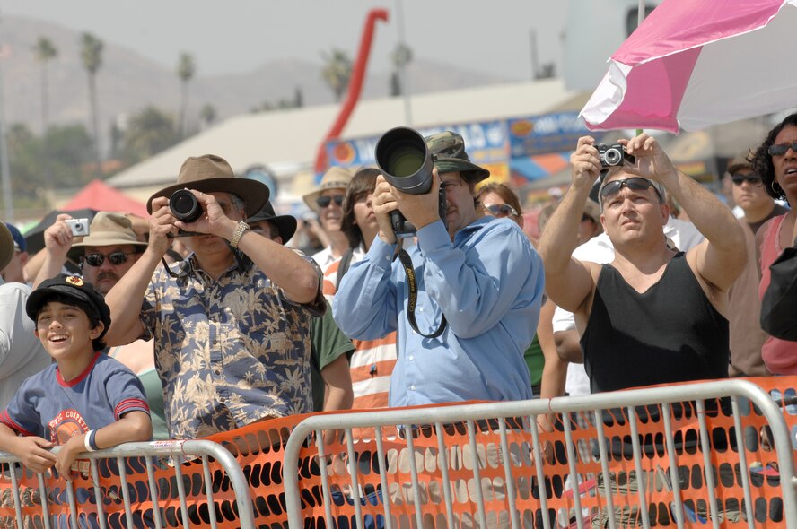 Amateur photographers record and enjoy the show at the March Air Reserve Base AirFest '08, Riverside, California on May 3, 2008.  The two day event featured both military and civilian aerial and ground demonstrations and was open to the public. (U.S. Air Force photo by SSgt John Herrick)