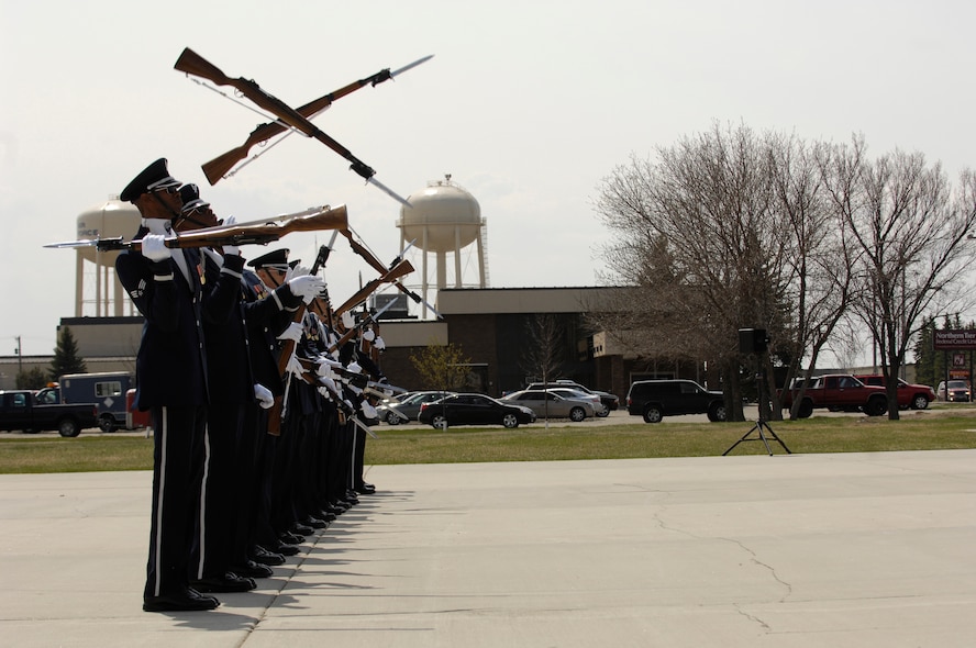 Rifles cross perfectly during the team's "line sequence" at Minot AFB. The AF Honor Guard Drill Team is the traveling component of the AF Honor Guard and tours world-wide representing all Airmen and showcasing USAF precision to recruit, retain, and inspire for the Air Force mission. (U.S. Air Force photo by Senior Airman Dan DeCook)(Released)