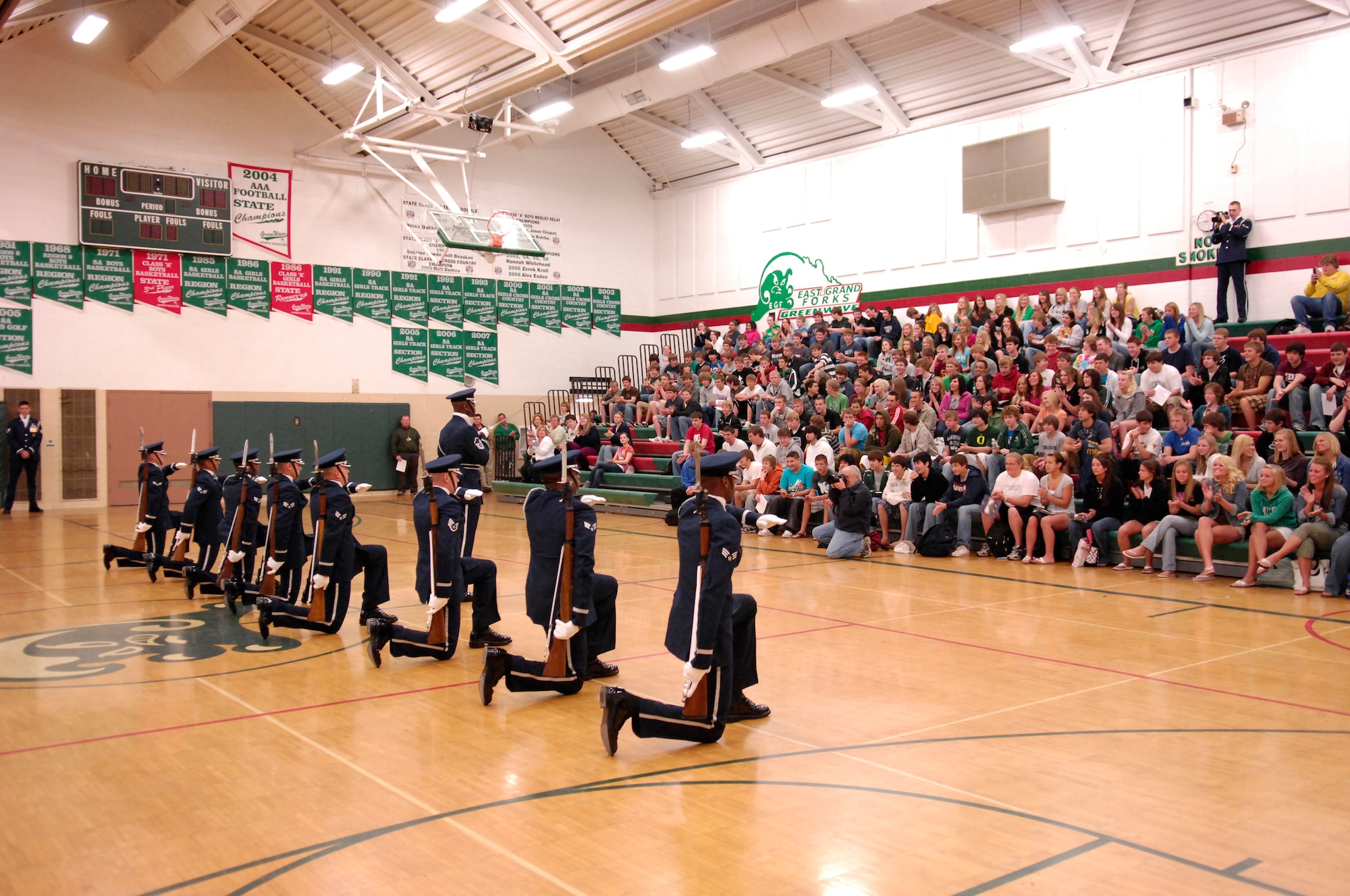 Students at East Grand Forks High School hold a special assembly to watch the team perform.  The AF Honor Guard Drill Team is the traveling component of the AF Honor Guard and tours world-wide representing all Airmen and showcasing USAF precision to recruit, retain, and inspire for the Air Force mission. (U.S. Air Force photo by Senior Airman Dan DeCook)(Released)