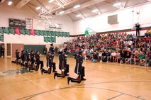 Students at East Grand Forks High School hold a special assembly to watch the team perform.  The AF Honor Guard Drill Team is the traveling component of the AF Honor Guard and tours world-wide representing all Airmen and showcasing USAF precision to recruit, retain, and inspire for the Air Force mission. (U.S. Air Force photo by Senior Airman Dan DeCook)(Released)