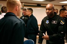 Master Sgt. Steven West, Drill Team Superintendent, speaks with an ALS student at Grand Forks AFB during an AF Honor Guard recruiting briefing.  The AF Honor Guard Drill Team is the traveling component of the AF Honor Guard and tours world-wide representing all Airmen and showcasing USAF precision to recruit, retain, and inspire for the Air Force mission. (U.S. Air Force photo by Senior Airman Dan DeCook)(Released)